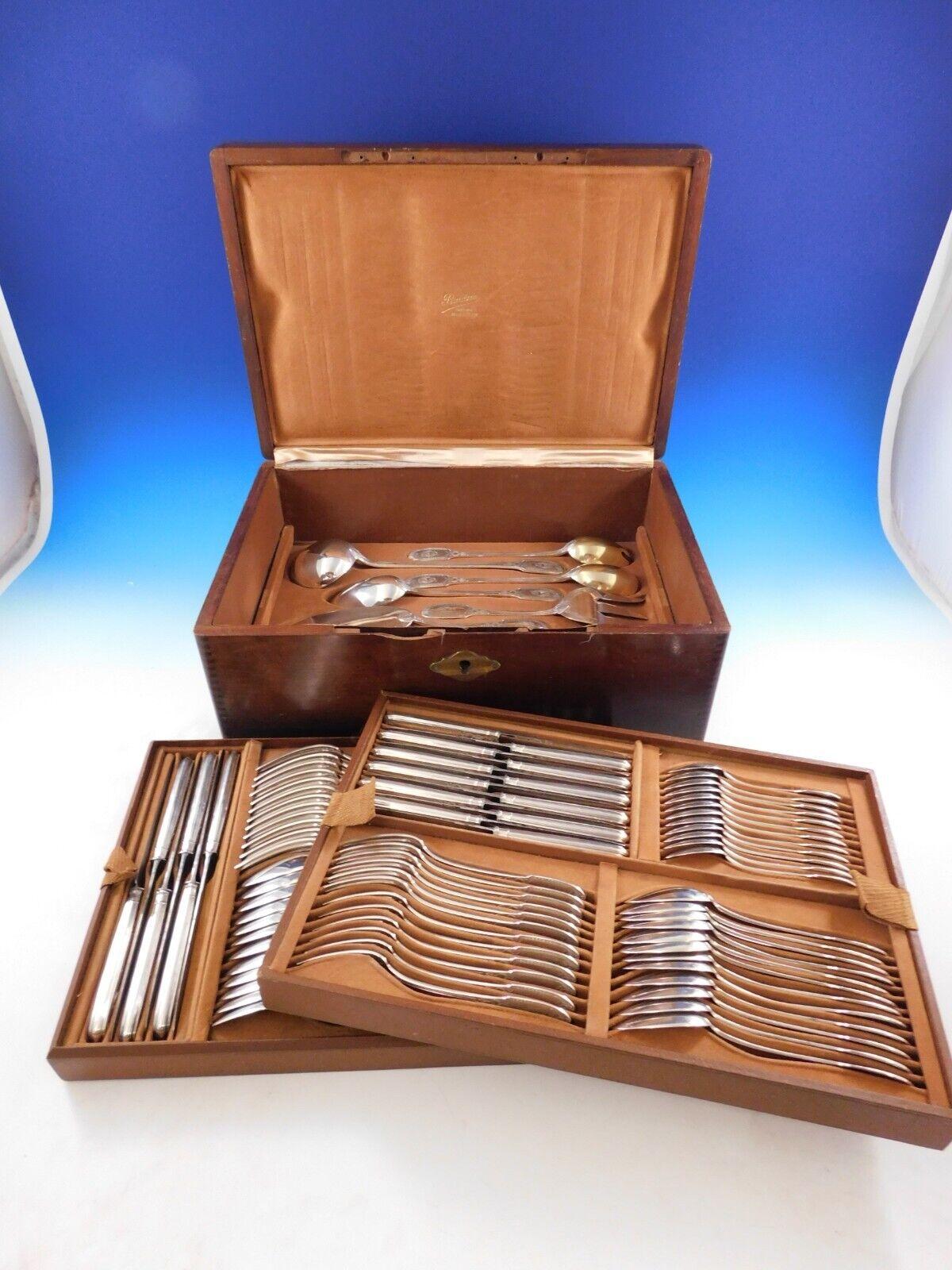 The Parisian silversmith Puiforcat is regarded as one of the legendary names in European silver craftsmanship. 
Superb Dinner Size Empire by Puiforcat sterling silver flatware set, 96 pieces. This rare pattern features an elegant swan motif. This