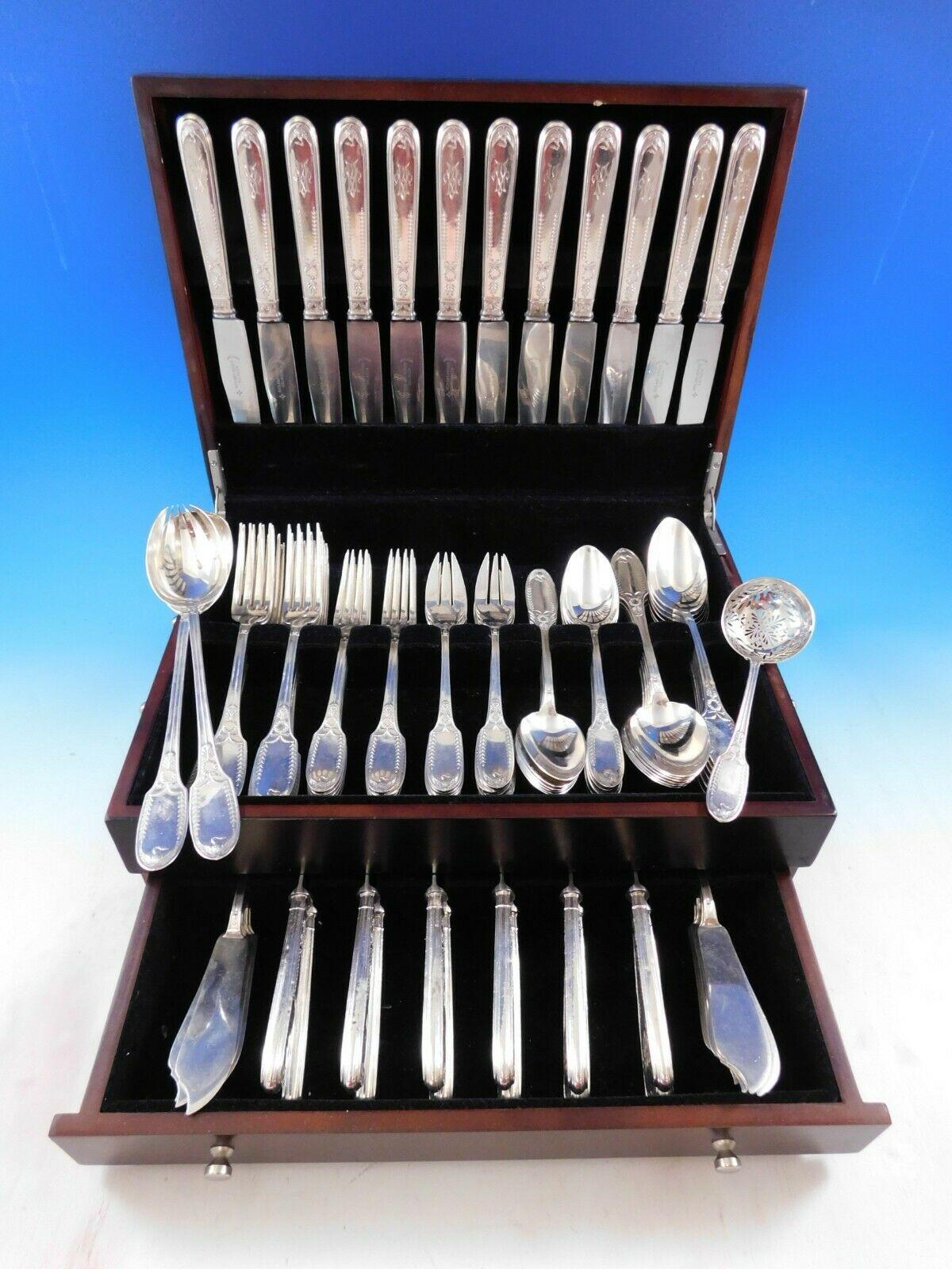 The Parisian silversmith Puiforcat is regarded as one of the legendary names in European silver craftsmanship. 
Superb Dinner Size Empire by Puiforcat sterling silver flatware set, 99 pieces. This rare pattern features an elegant swan motif. This
