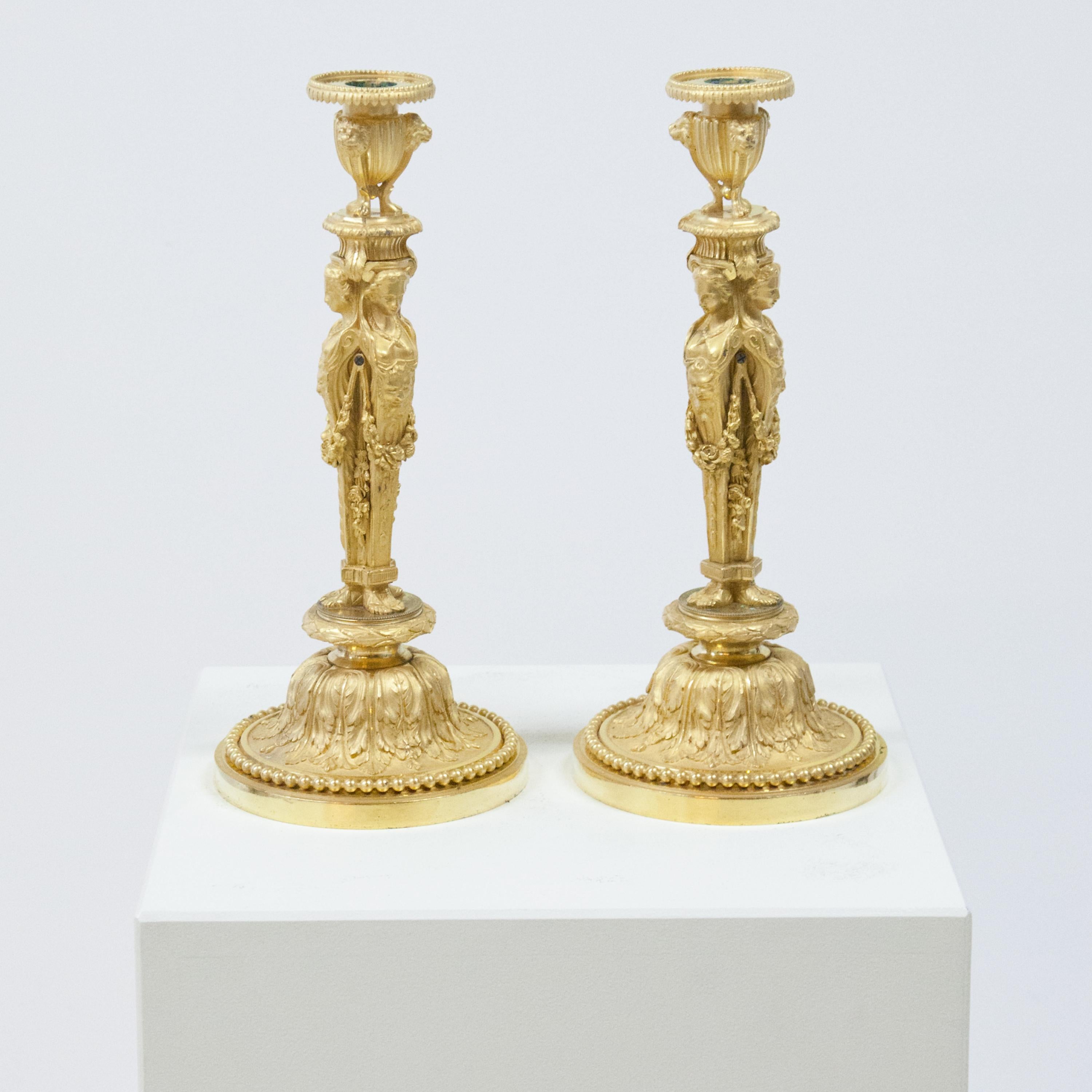 Empire candelabras with four female herms after a model by Jean-Démosthène Dugourc in the so-called grotesque style. Fire-gilded bronze.
     