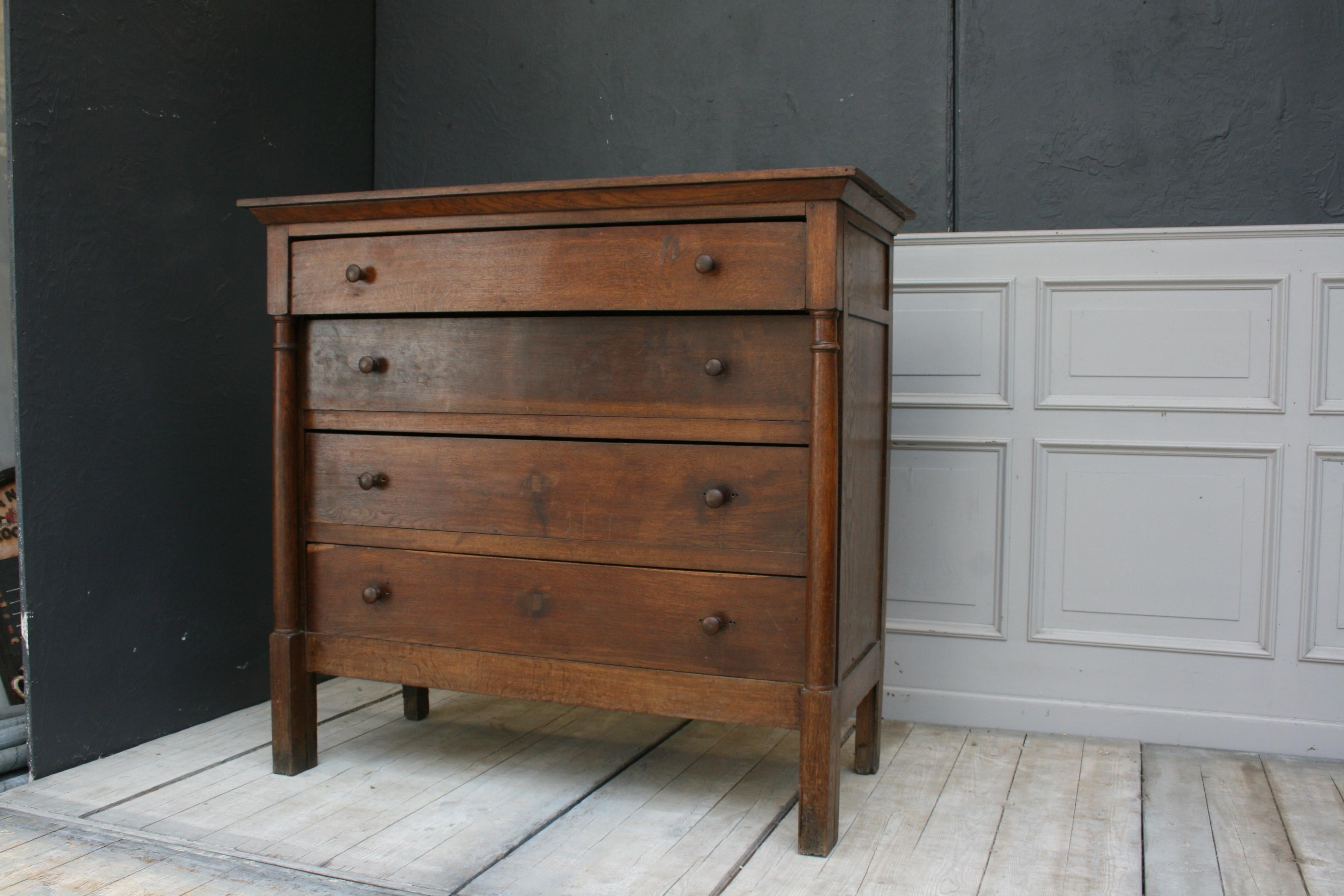 Empire men’s / high chest with four drawers. Wooden buttons instead of the original fittings. Approximately 1820th.
Dimensions: 124 cm high, 132 cm wide, 61 cm deep.
 