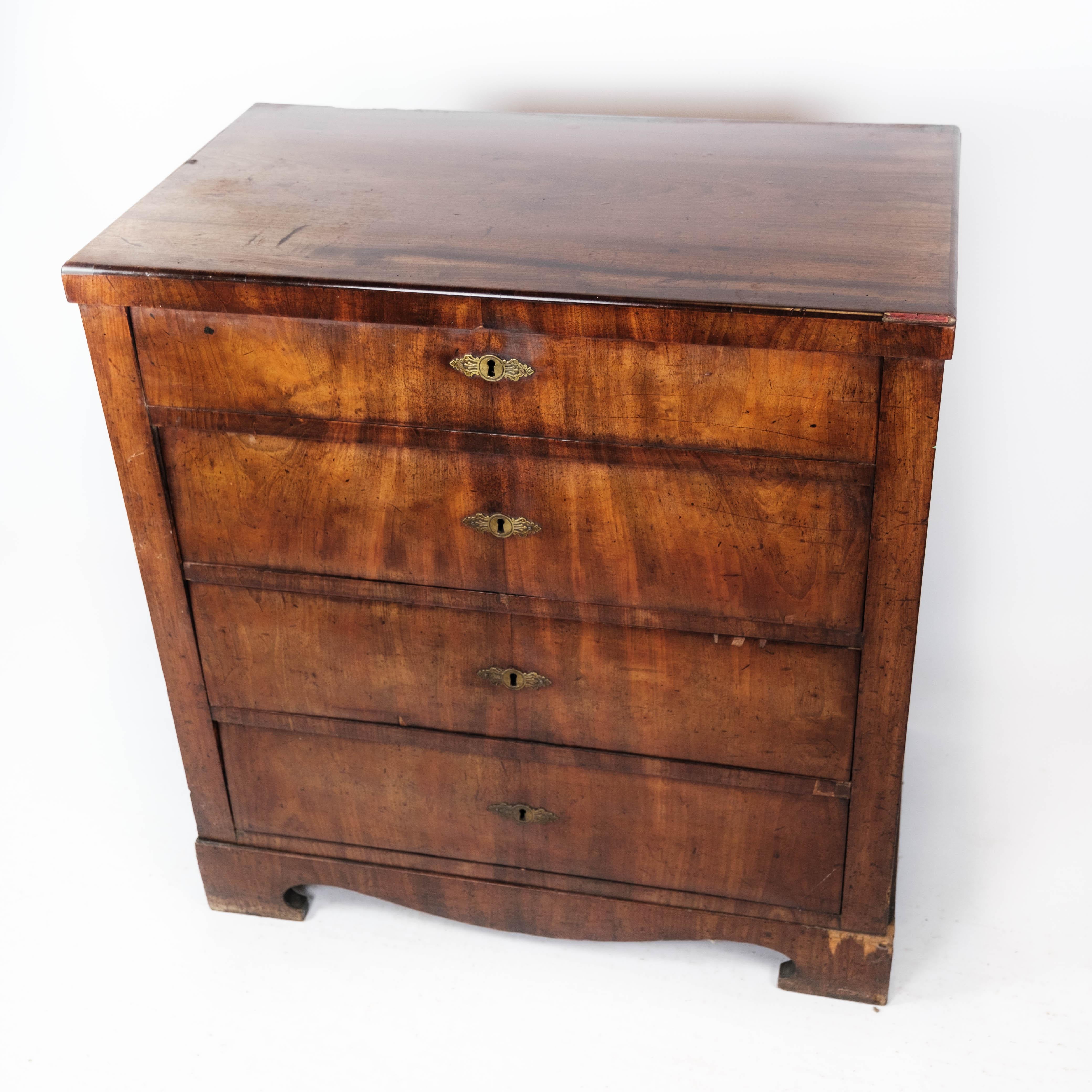 
This exquisite Empire chest of drawers boasts a timeless design and is crafted from rich mahogany, reflecting the elegance of the 1840s. With its stately presence and intricate detailing, it serves as both a functional storage piece and a