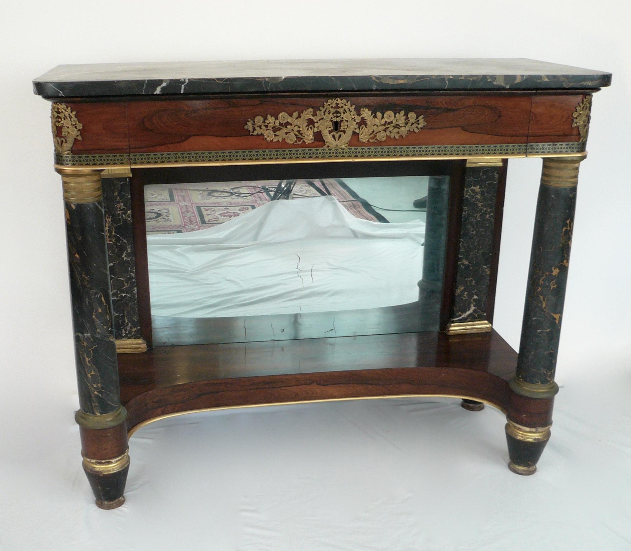 This handsome American classical pier table features cut brass borders, bronze mounts, and 'Egyptian' marble columns, pilasters, and top.