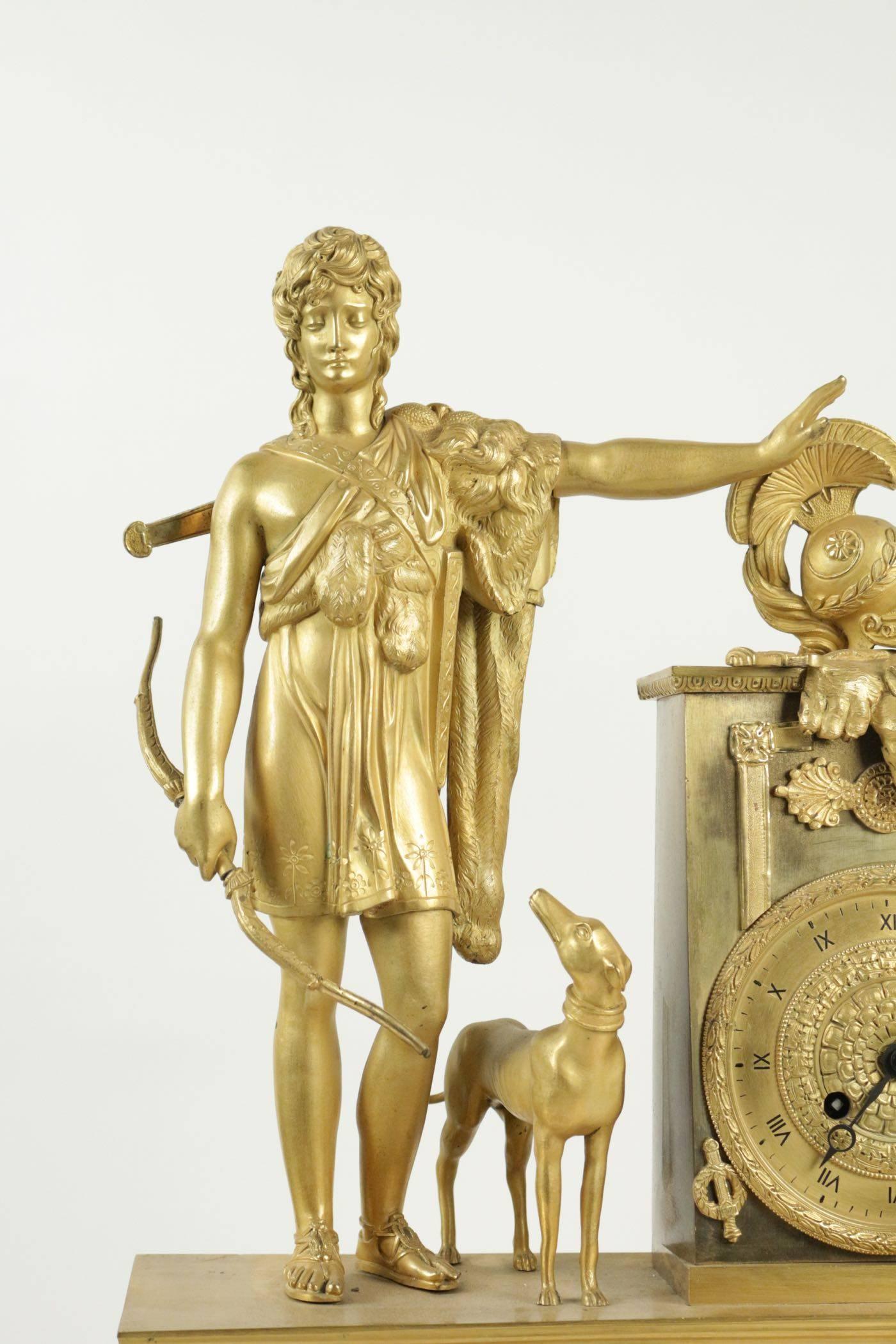 Empire clock from the 19th century in gold gilt bronze. 
Measure: L 39cm, H 54cm, P 13cm.