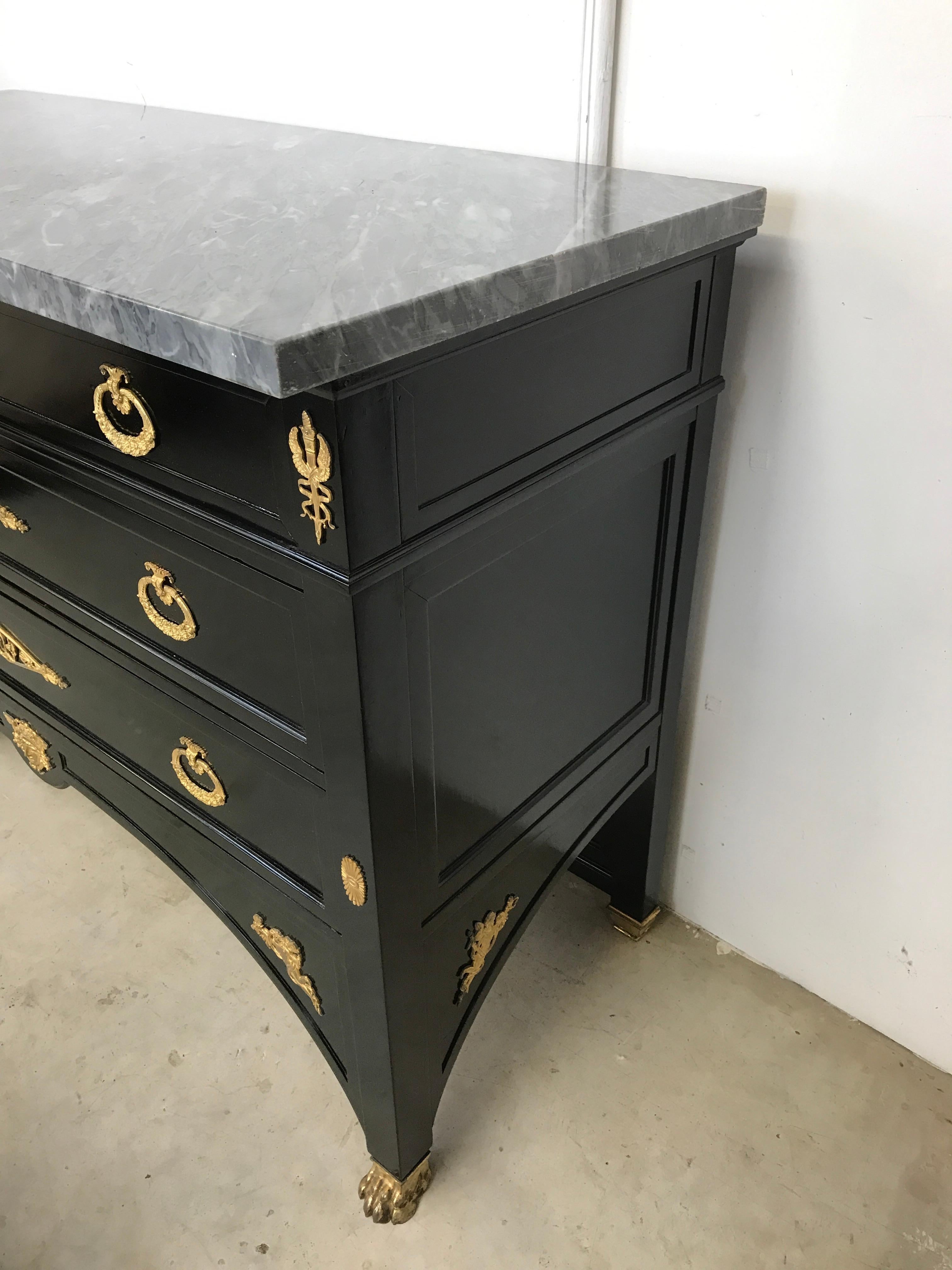 A exceptional empire style commode, with ormolu mounts and bronze feet. With a very smart blue/grey marble. A rare and unusual model, in exceptional condition. The maker's name is on the back of the commode. This is the only commode, I've seen like