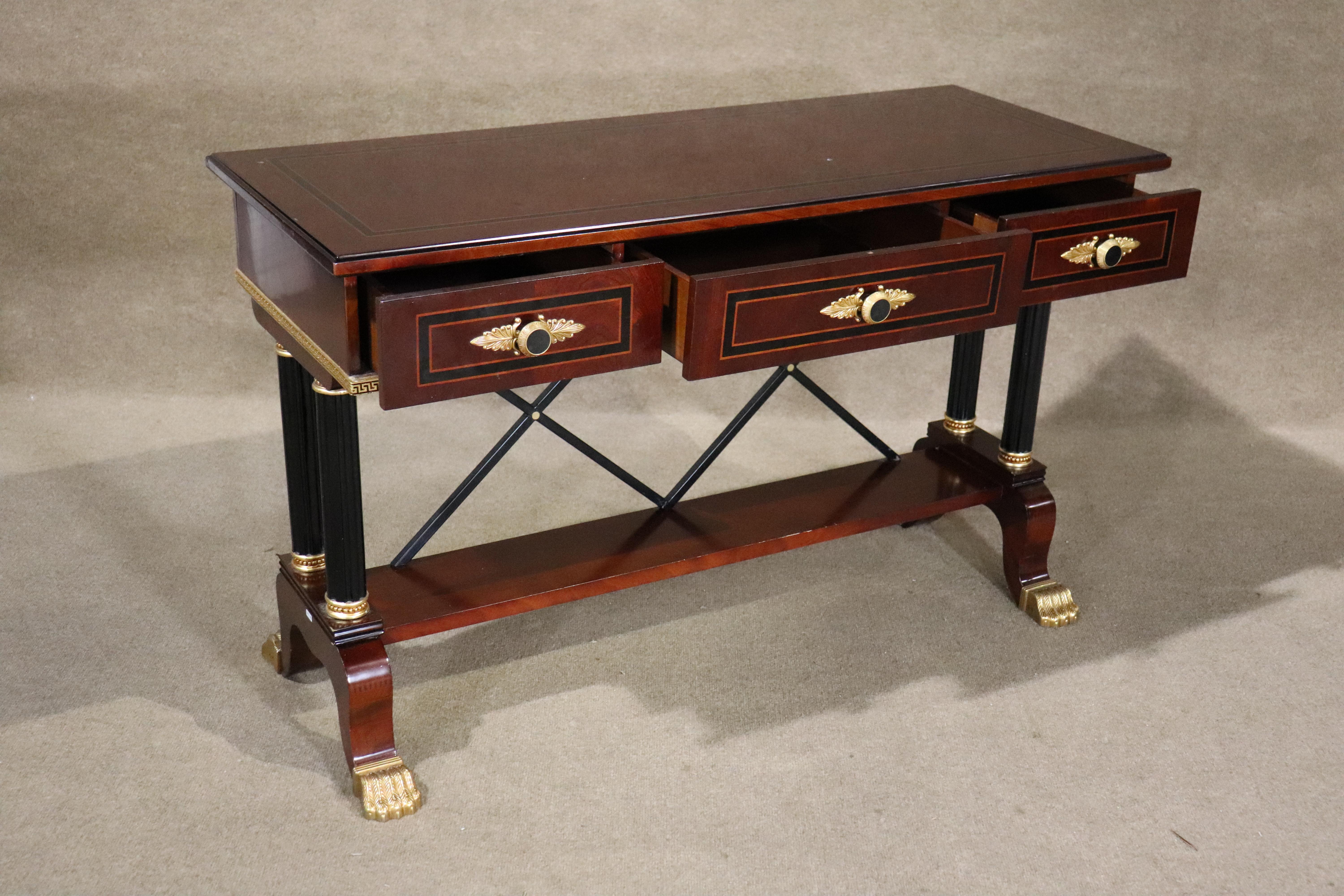 This Empire style console table features golden claw feet, criss-cross back, and inlay top trim. Great for entry way or behind a sofa.
Please confirm location NY or NJ
