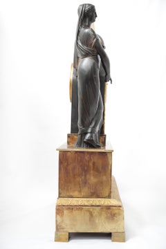 Empire Era Fire-Gilt Bronze Clock Representing a Figure in Neo-Egyptian Style