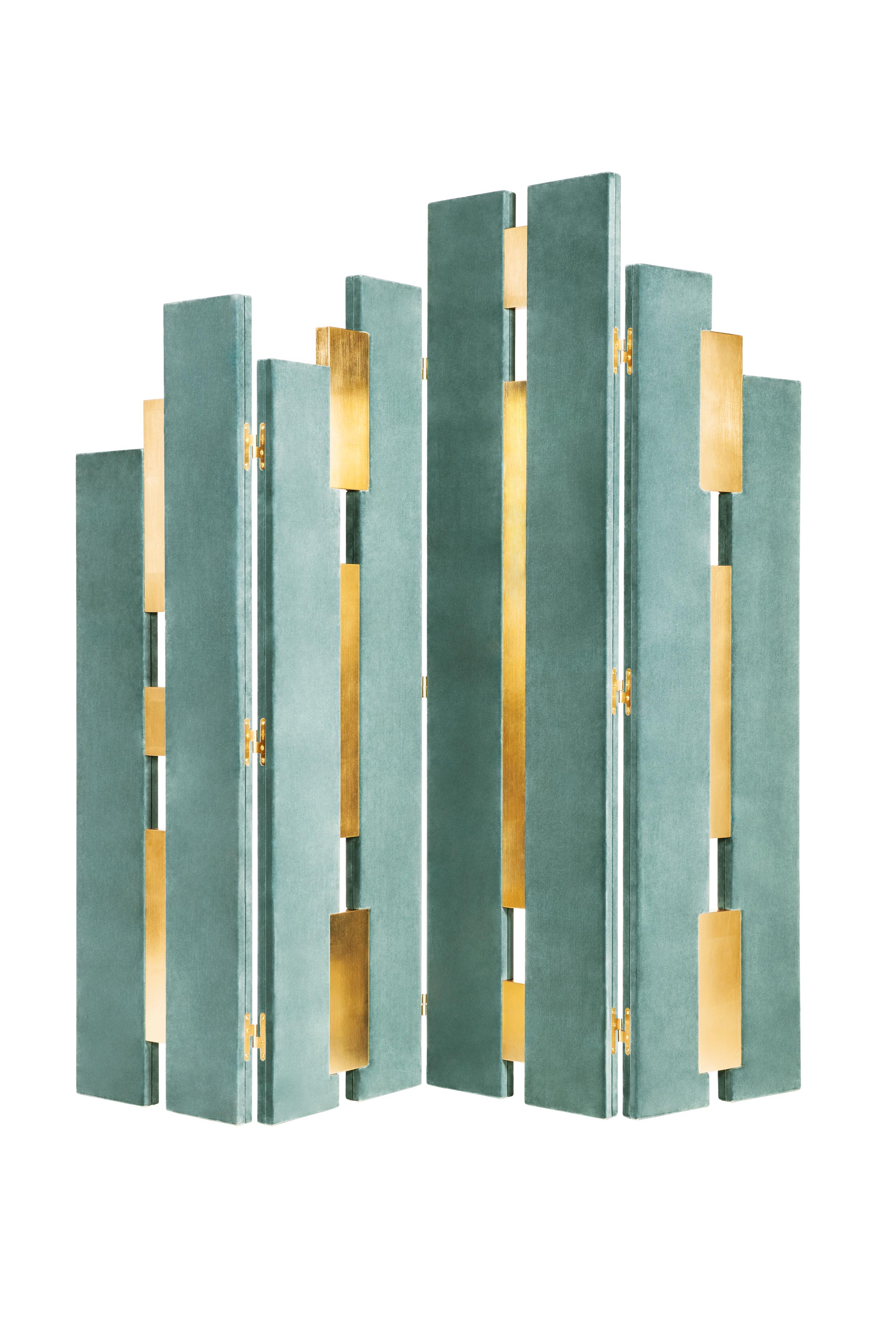 Empire Folding Screen by Munna
Dimensions: D 5 x W 212 x H 201 cm. 
Materials: Wood, upholstery, gold leaf, and brass.
Finish: Upholstery: Cotton Velvet, ref. Steel Blue, CV27. Wood panels: Gold Leaf with a gloss finish. Metal details: Polished