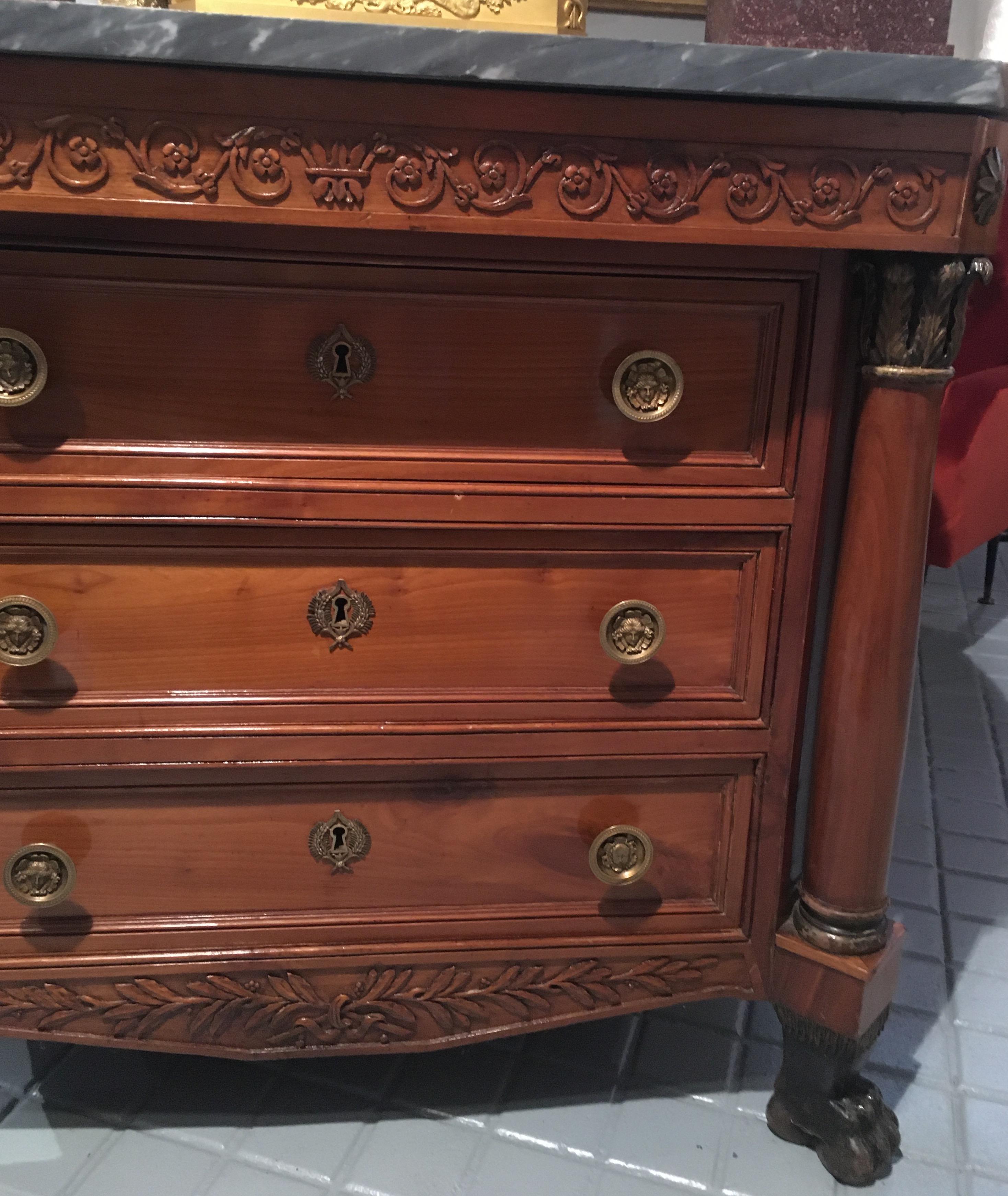 Columns and drawers in front and two side doors with small compartments.
Nice patina and finely carved.
Constructed in cherrywood with originals brass handles and bleu turquin top.
Rising in lion’s paw feet.
 
  