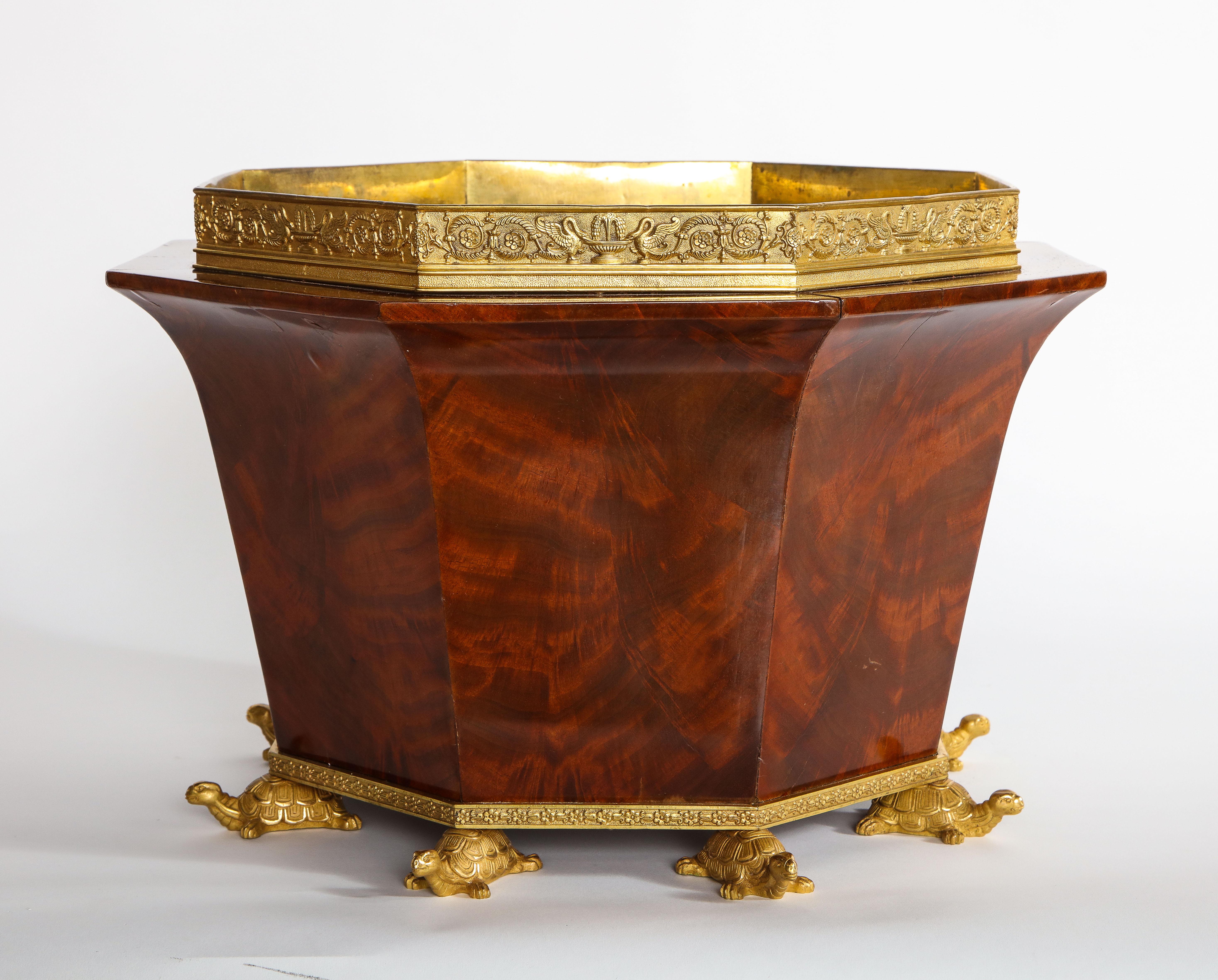 A Fantastic and Very Important Empire Period German Ormolu-Mounted Mahogany Jardiniere Mounted on Dore Bronze Turtle Feet, In The Manner Of Johannes Klinkerfuss And Casimir Münch. This is truly a masterpiece jardiniere and was crafted by two of the
