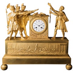 Pendule Empire en bronze patiné et doré