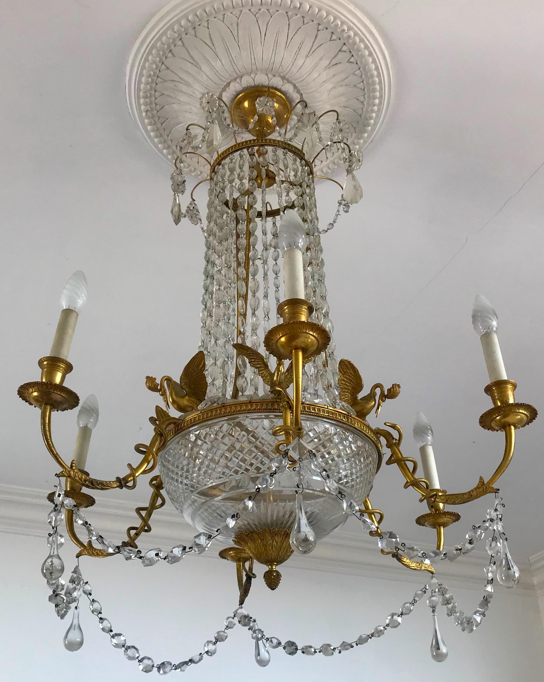 Finely chiseled gilt bronze and cut crystal Empire elegant chandelier with six arms.
Six E 14 light bulbs.