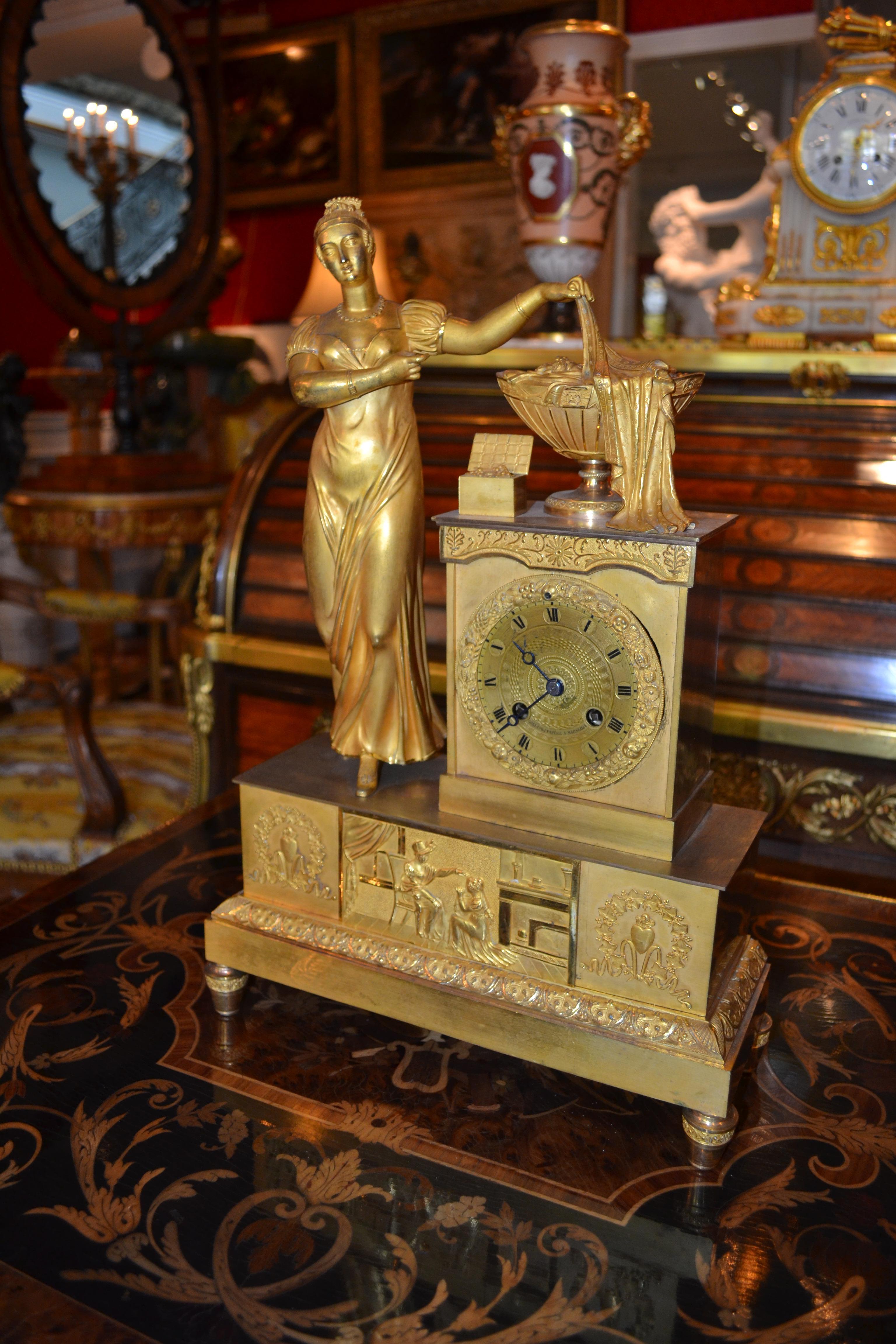 Empire Gilt Bronze  Clock of Standing Classical Lady Unveiling an Urn of Plenty For Sale 5