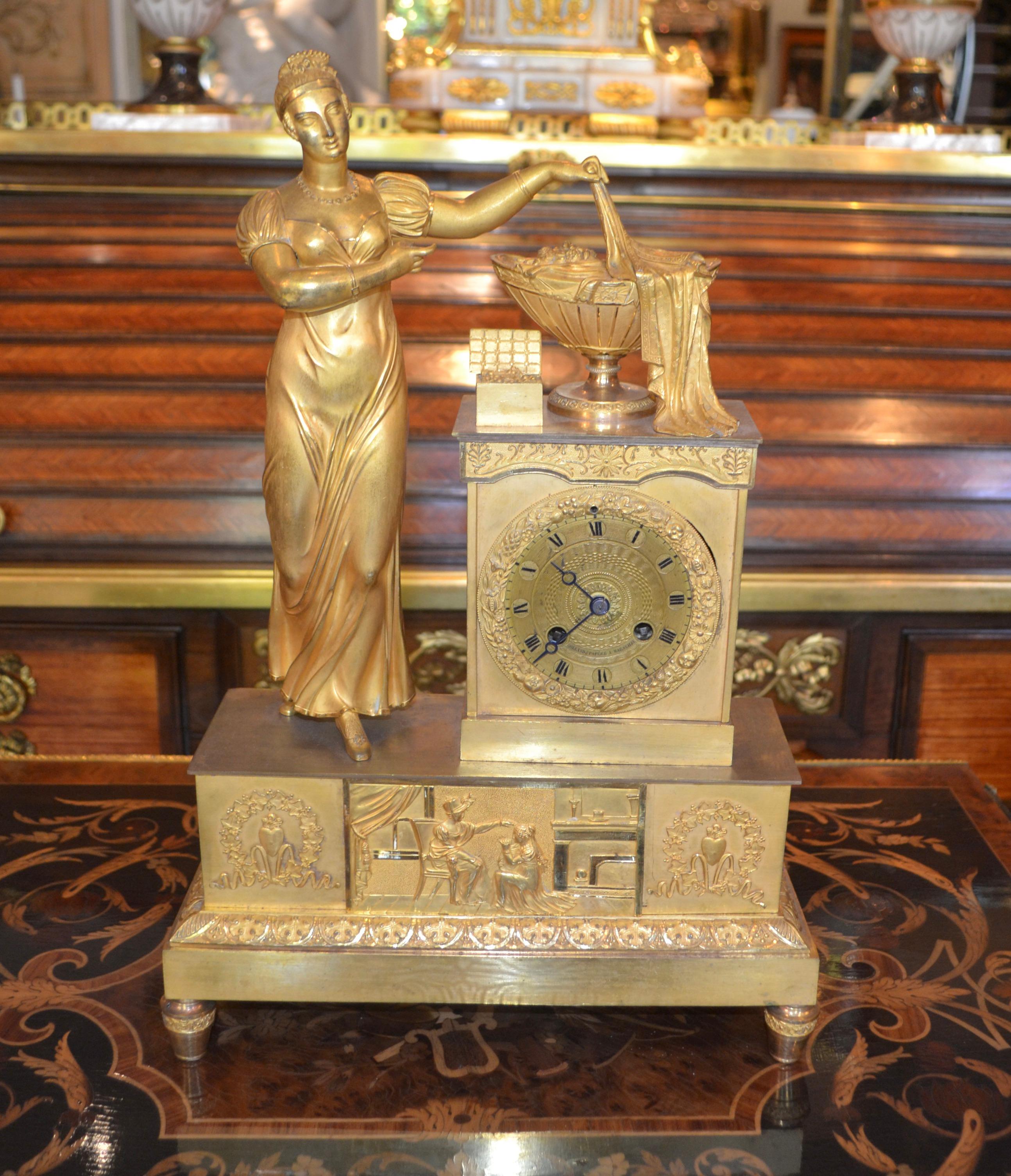 Empire Gilt Bronze  Clock of Standing Classical Lady Unveiling an Urn of Plenty For Sale 3