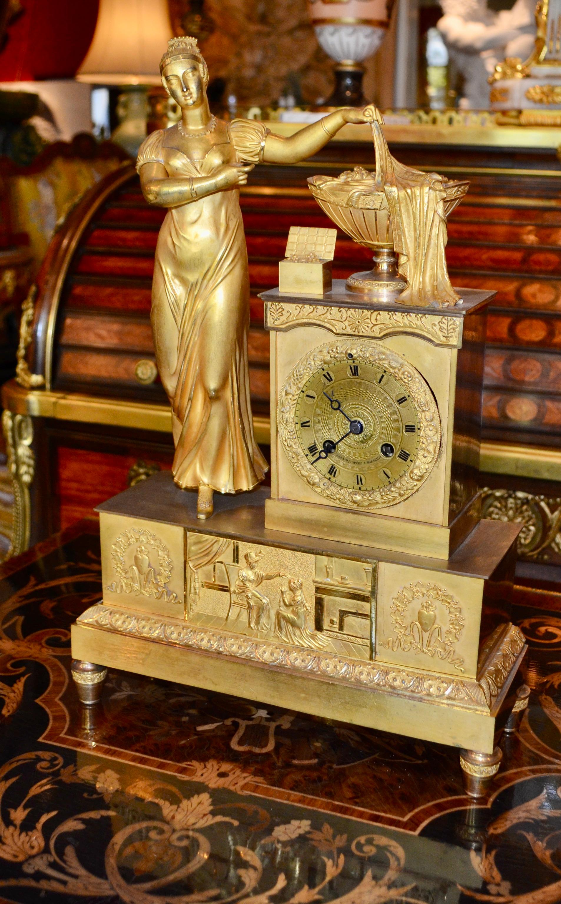 Empire Gilt Bronze  Clock of Standing Classical Lady Unveiling an Urn of Plenty For Sale 4