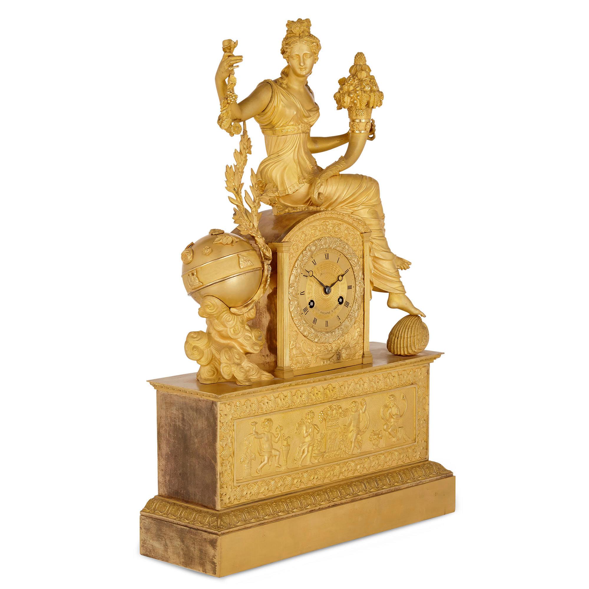 This large and impressive gilt bronze mantel clock is by the French Michel-François Piolaine. The clock body is raised by an architecturally formed, plinth-shaped base, set to the front with a relief scene, also of gilt bronze, portraying four putti