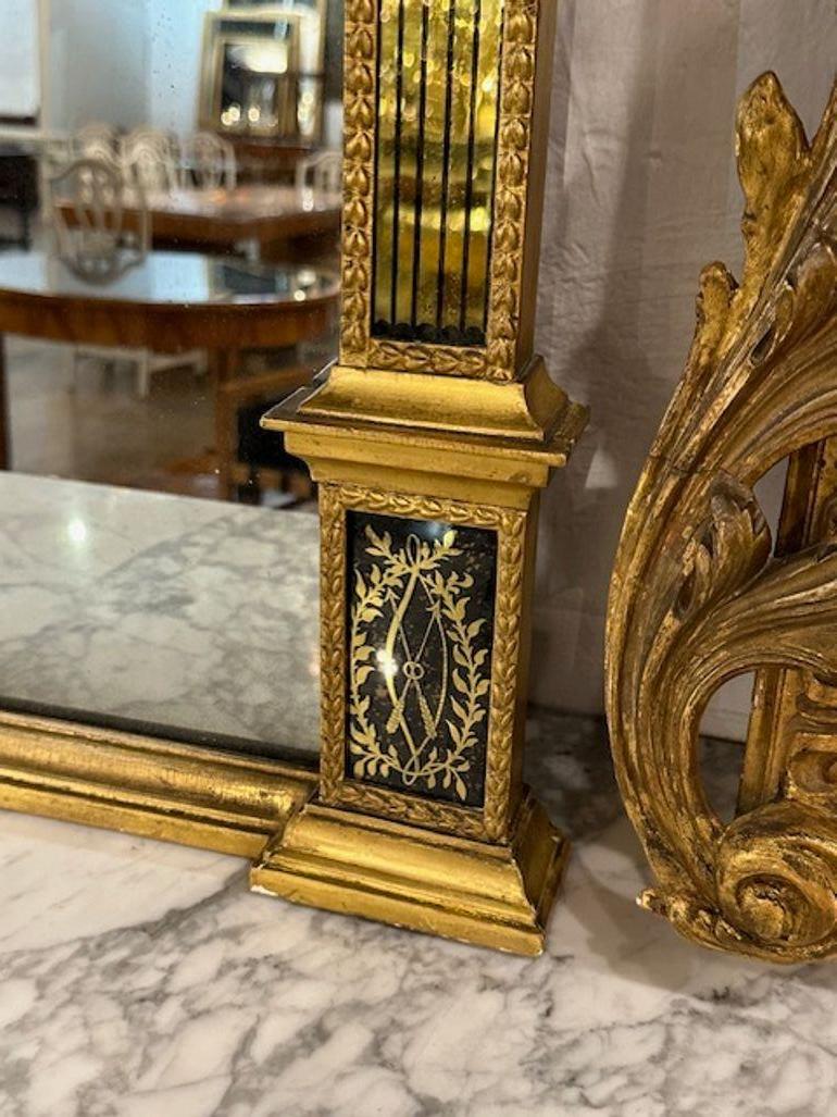 XIXe siècle Miroir Empire en bois doré et églomisé en vente