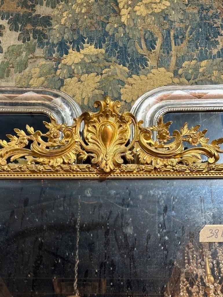 Rare 19th century French empire giltwood and eglomise' mirror.. Circa 1840. Sure to make a statement!
