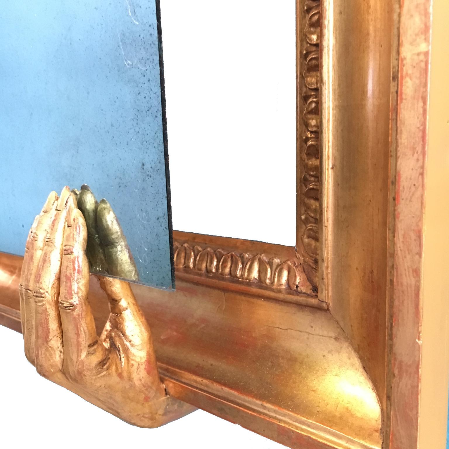Italian Empire Giltwood Wall Mirror with Four Hands Sculptures Holding the Mirror For Sale