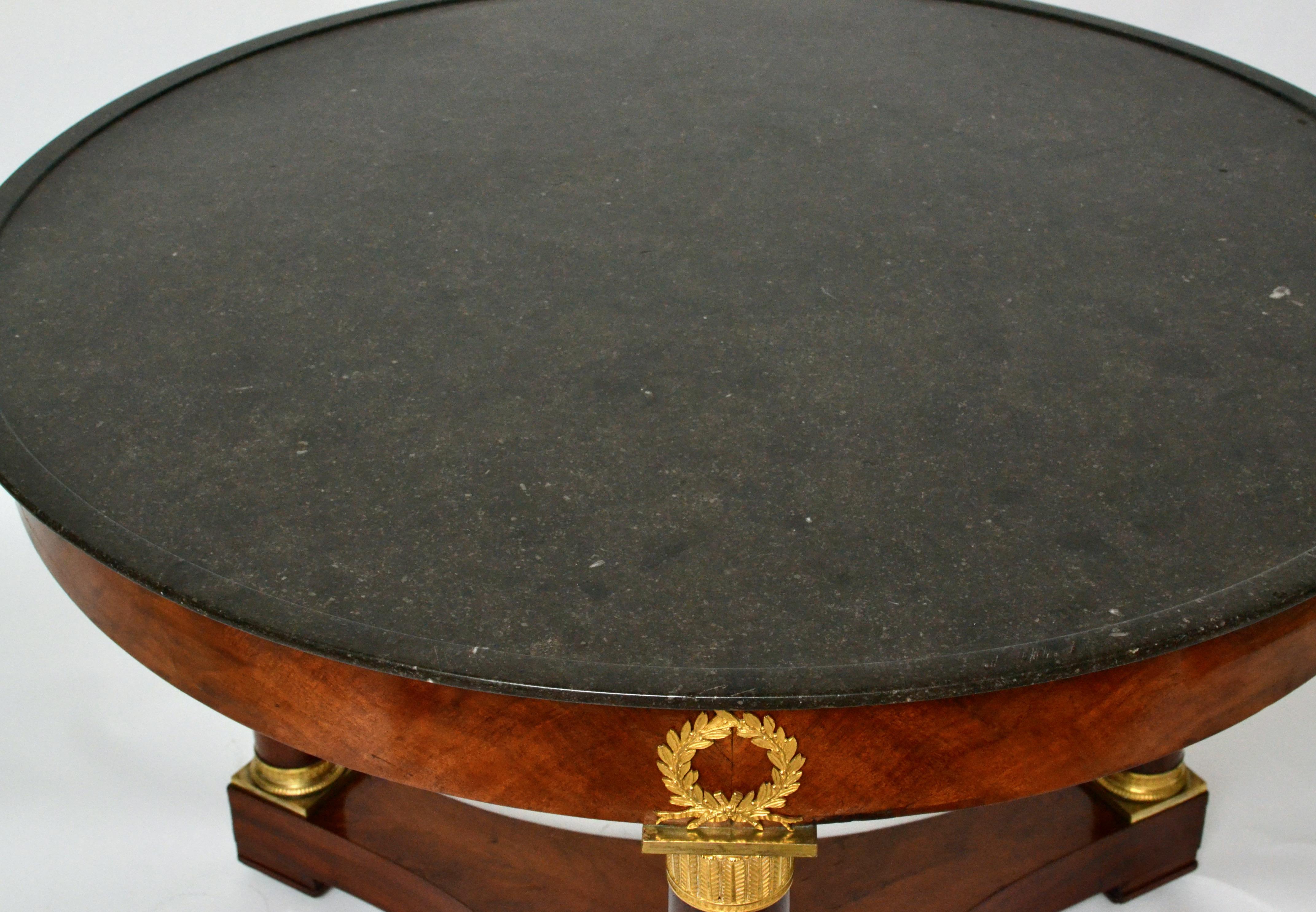 Mahogany Empire Gueridon or Center Table With Black Marble Top With Gilt Bronze Mounts.