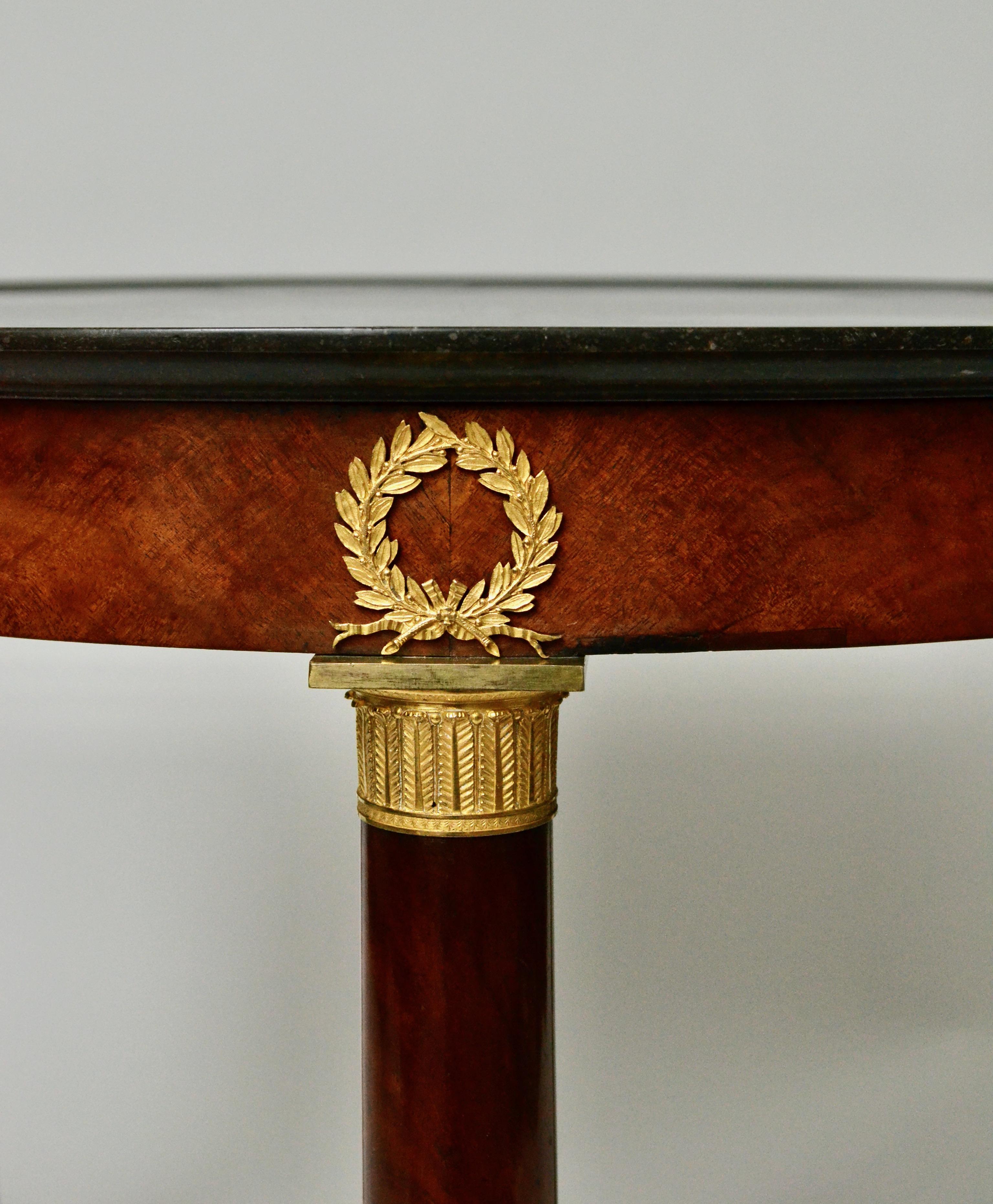 Empire Gueridon or Center Table With Black Marble Top With Gilt Bronze Mounts. 1