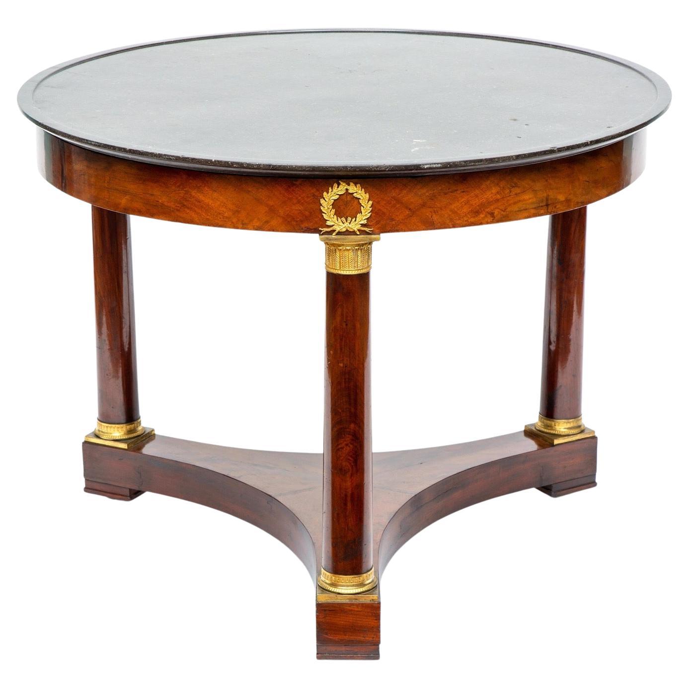 Empire Gueridon or Center Table With Black Marble Top With Gilt Bronze Mounts.