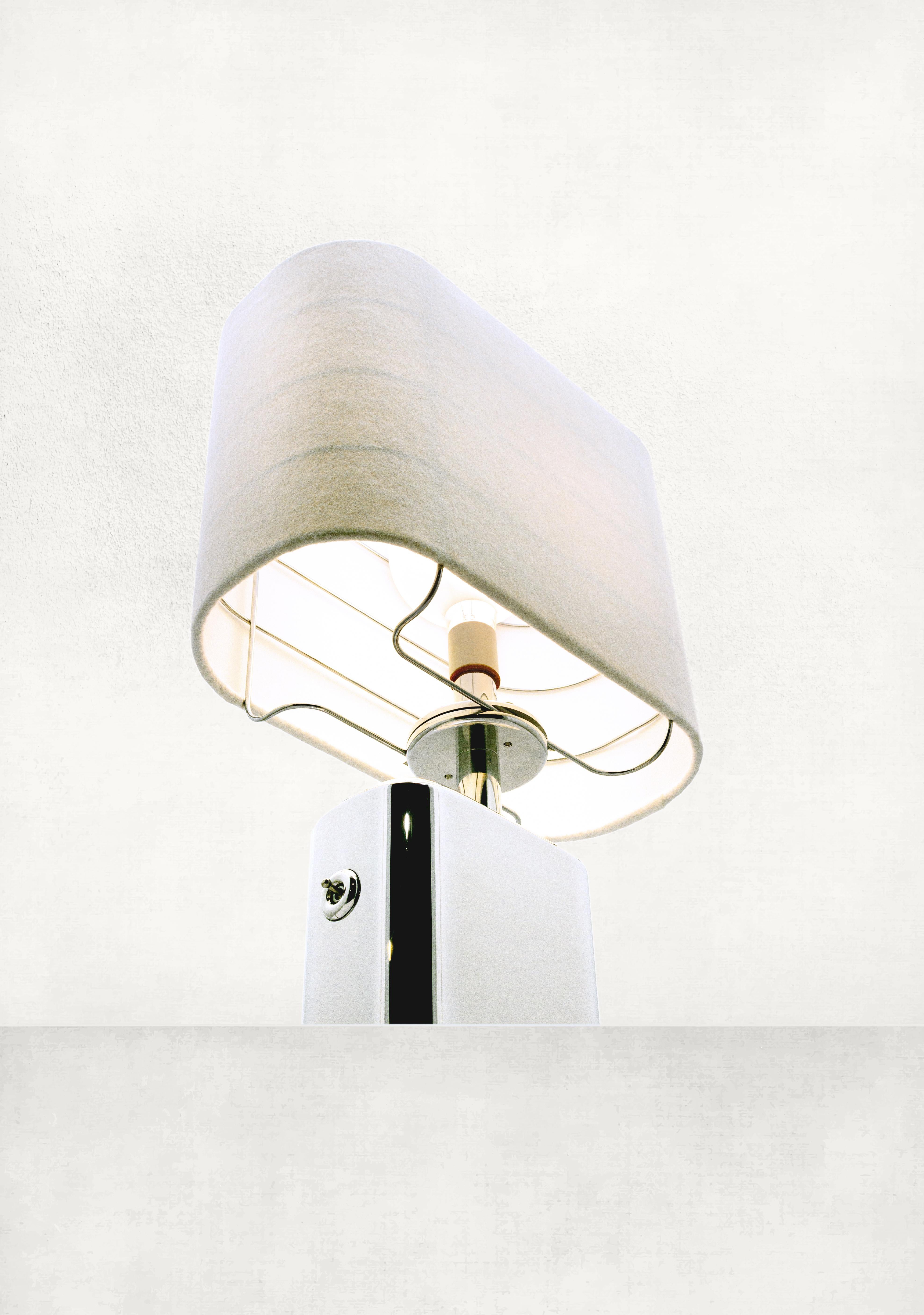 This is the Empire Lamp, an extruded aluminum table lamp that is now in production. There are made in a limited series of 100. Each lamp will be stamped the number corresponding its place in the production run.  The center portion of the lamp base