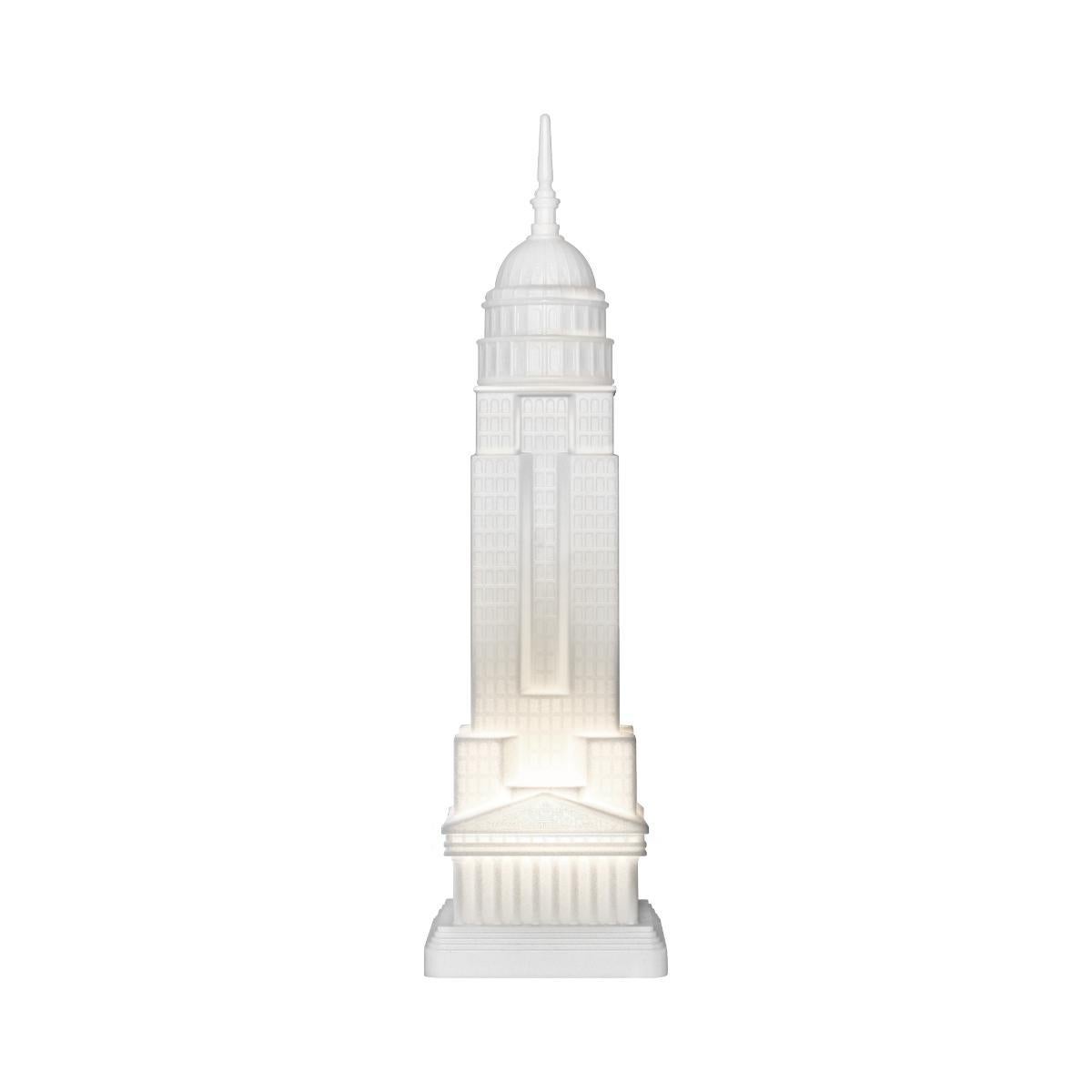 Empire is a lamp by Studio Job, that combines three unlike architectural icons, symbols of power in different ages: starting with the Parthenon on the bottom, it grows with the imposing presence of the Empire State Building and ends with the Capitol