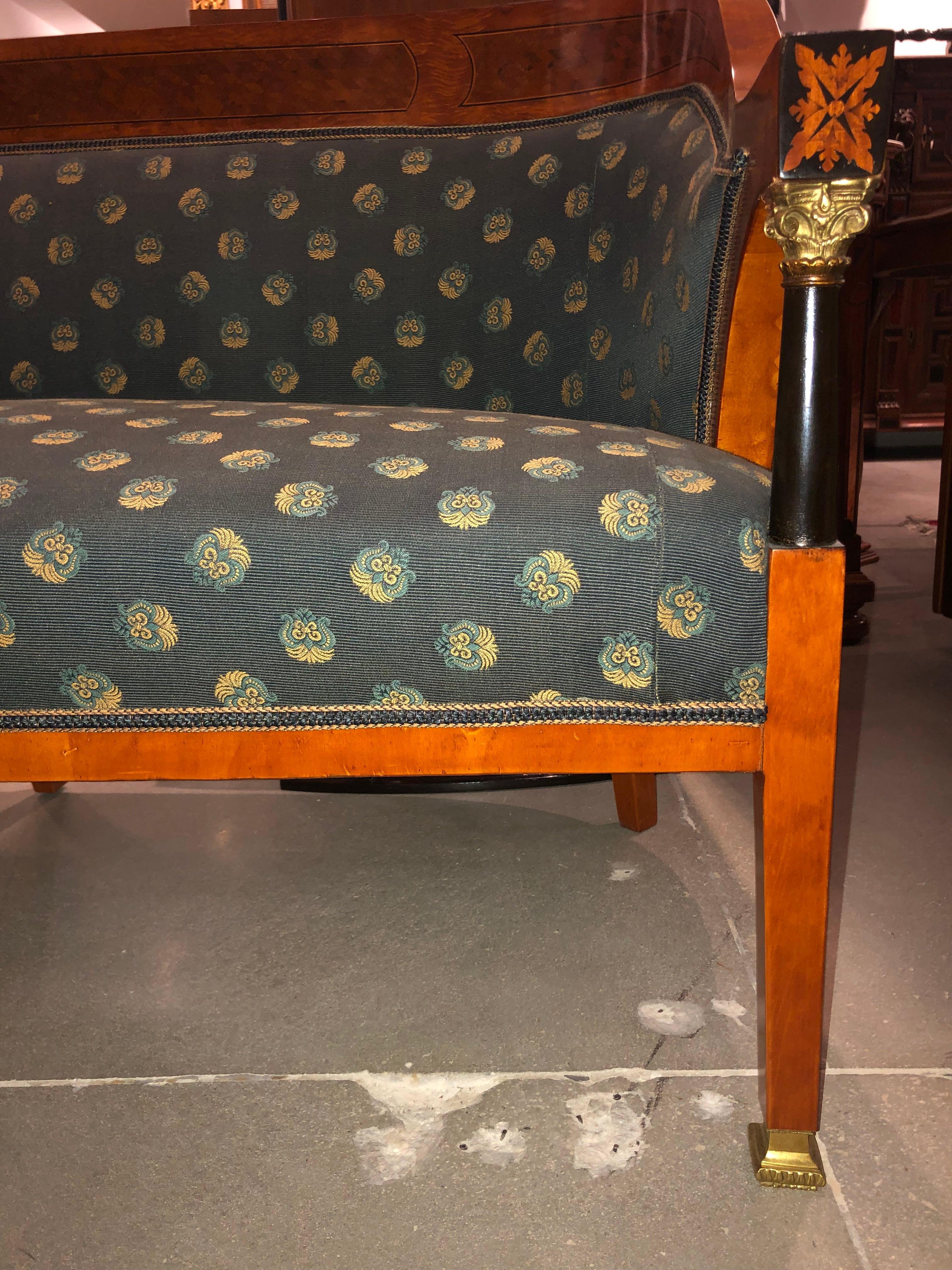 Walnut, rootwood and ebony with gilt bronze fittings. Slate blue upholstery with gold/teal floral pattern, circa 1890-1910. Part of a suite with Chairs E3/090-1.