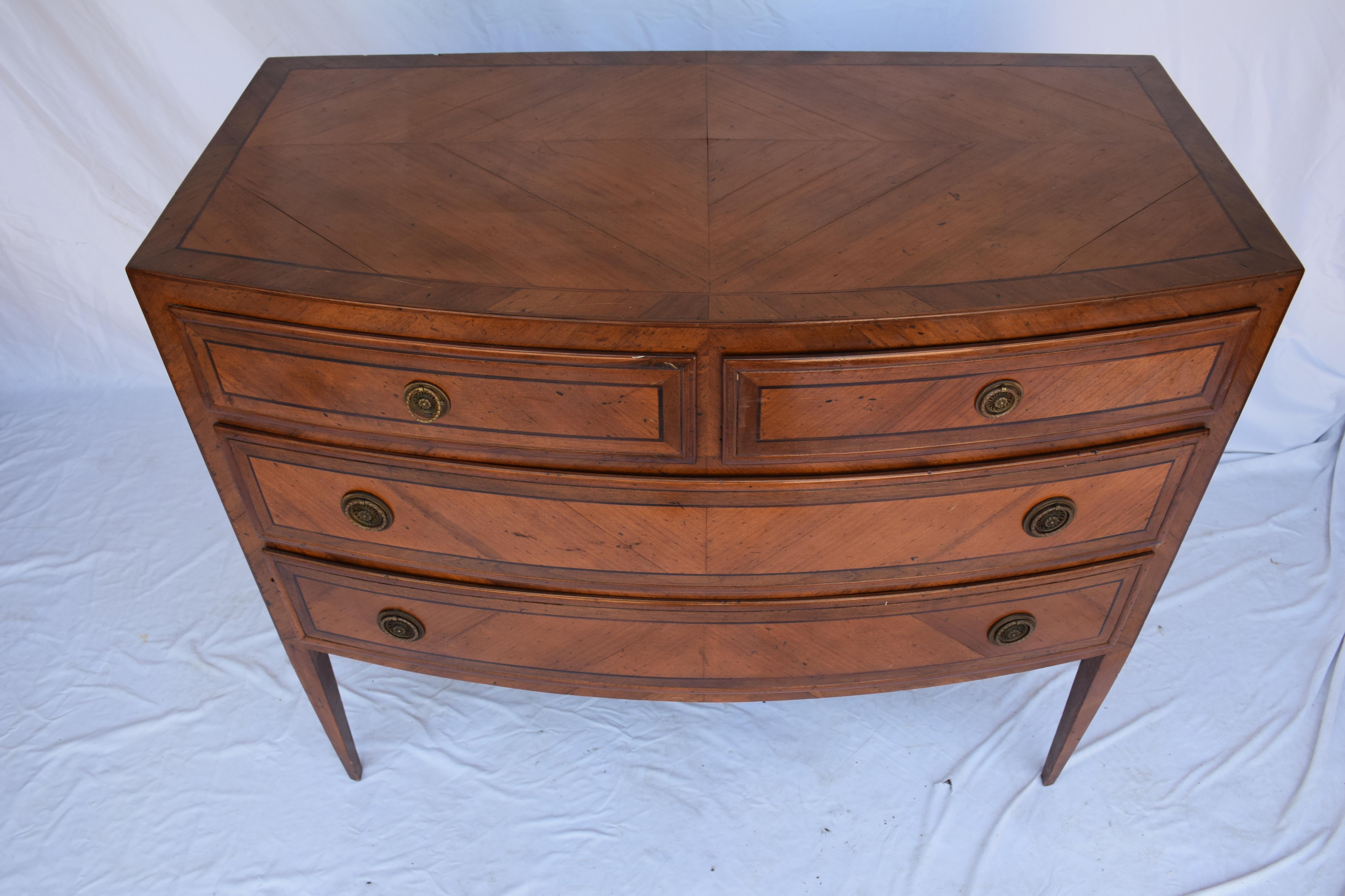 Beautiful 2-tone Empire Barrel faced Mahogany Empire Chest with four drawers and brass tone round pulls hardware. Suitable as a stand-alone chest or as a bedside chest. Each drawer is fully lined on the bottom and sides with a small green printed