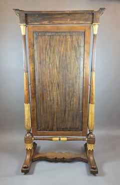 Empire mahogany and giltwood psyche mirror, 19th century