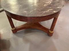 Empire mahogany and gray marble top center table