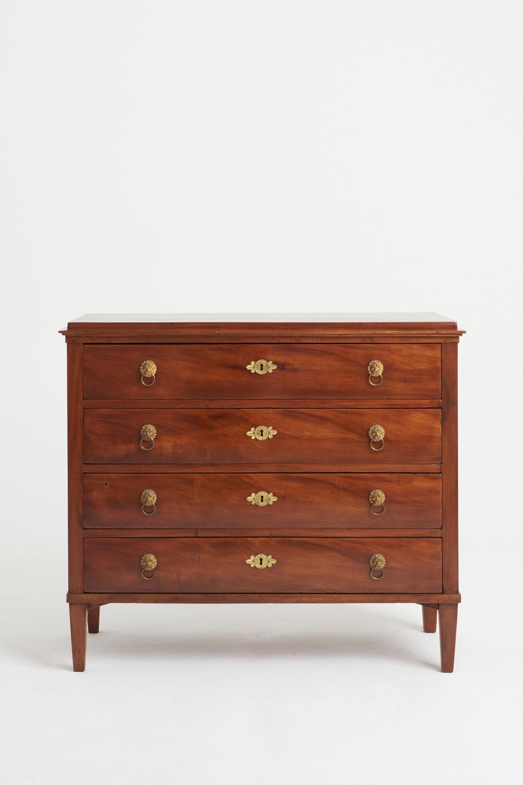 A Mahogany and gilt bronze mounts chest of drawers, the top drawer revealing a secretaire.
Sweden, early 19th Century
93 cm high by 107.5 cm wide by 48 cm depth