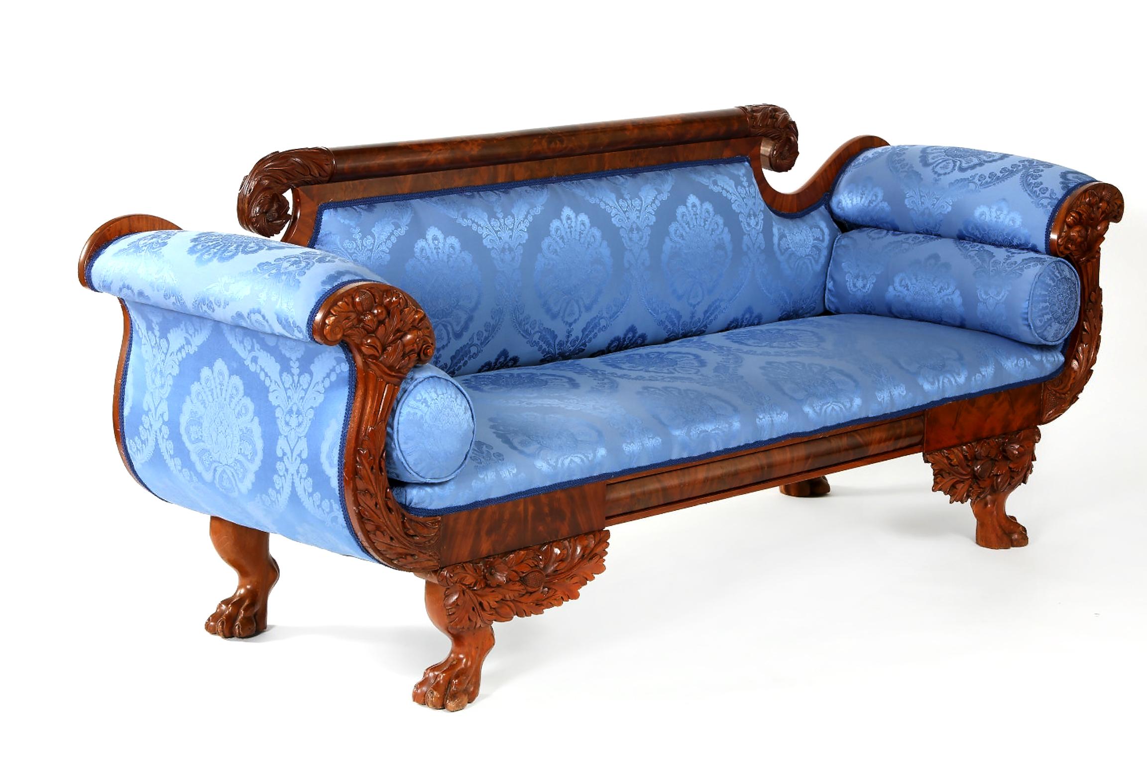Empire style mahogany wood framed hand carved scroll arm sofa. The sofa is very sturdy and in good condition with wear consistent with age / use. The upholstery is very immaculate. The sofa is about 86 inches long x 23 inches wide x 30 inches high.
