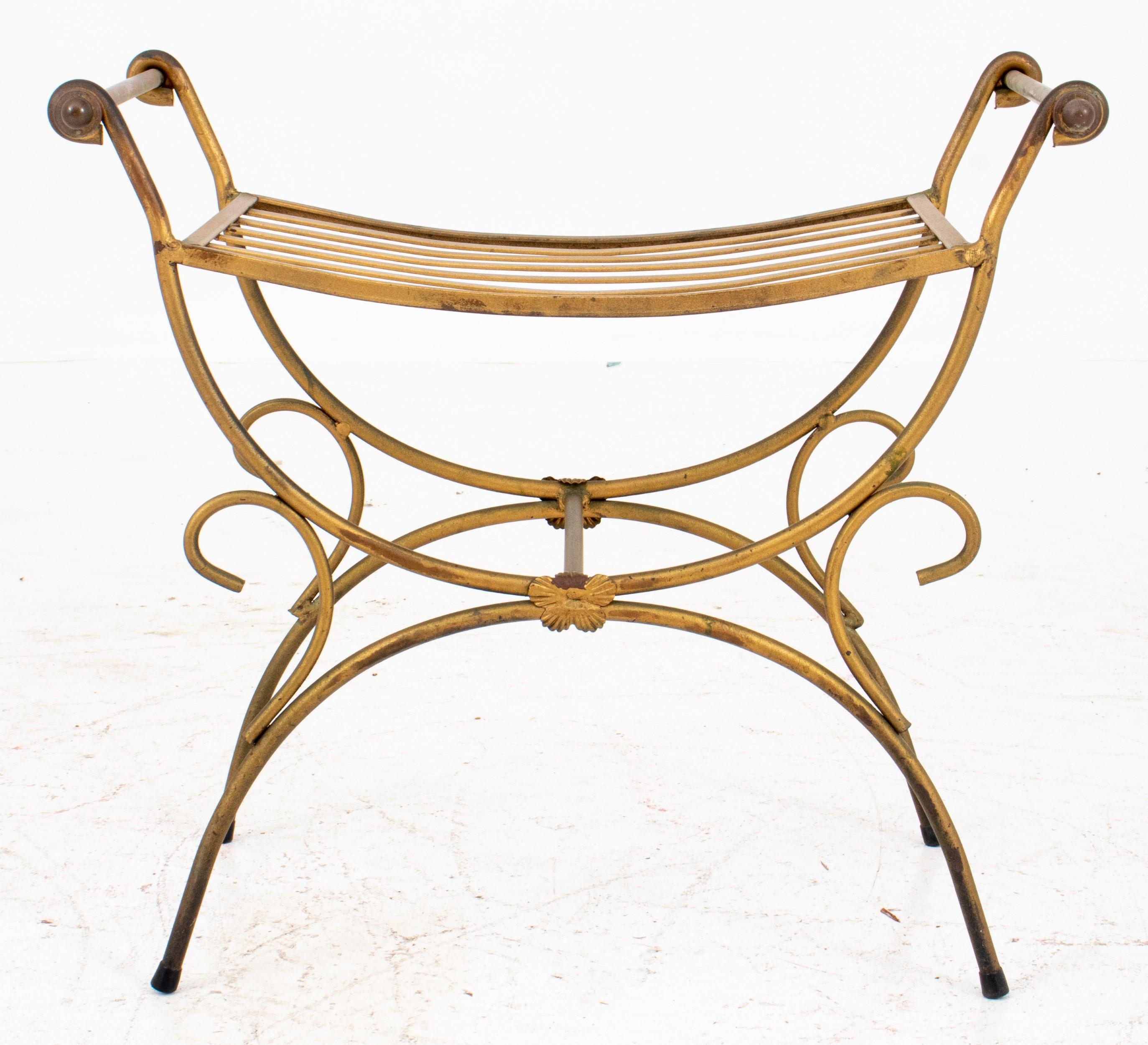 Empire manner giltmetal curule bench. Here's a breakdown of its key features:

Style: Empire manner - This refers to a design style inspired by the neoclassical aesthetic of the French Empire period (early 19th century).

Material: Giltmetal - This