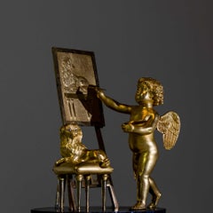 Pendule Empire avec Amor comme peintre, Dubuc À Paris, vers 1810