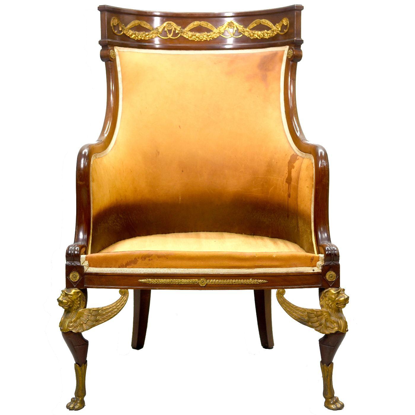 Empire desk chair in rich mahogany gilt bronze register decorated with griffins and flower garlands from the 1880 period, dimension height 106 cm for a width of 76 cm and a depth of 50 cm. Note that the leather is damaged (tears and stains) This