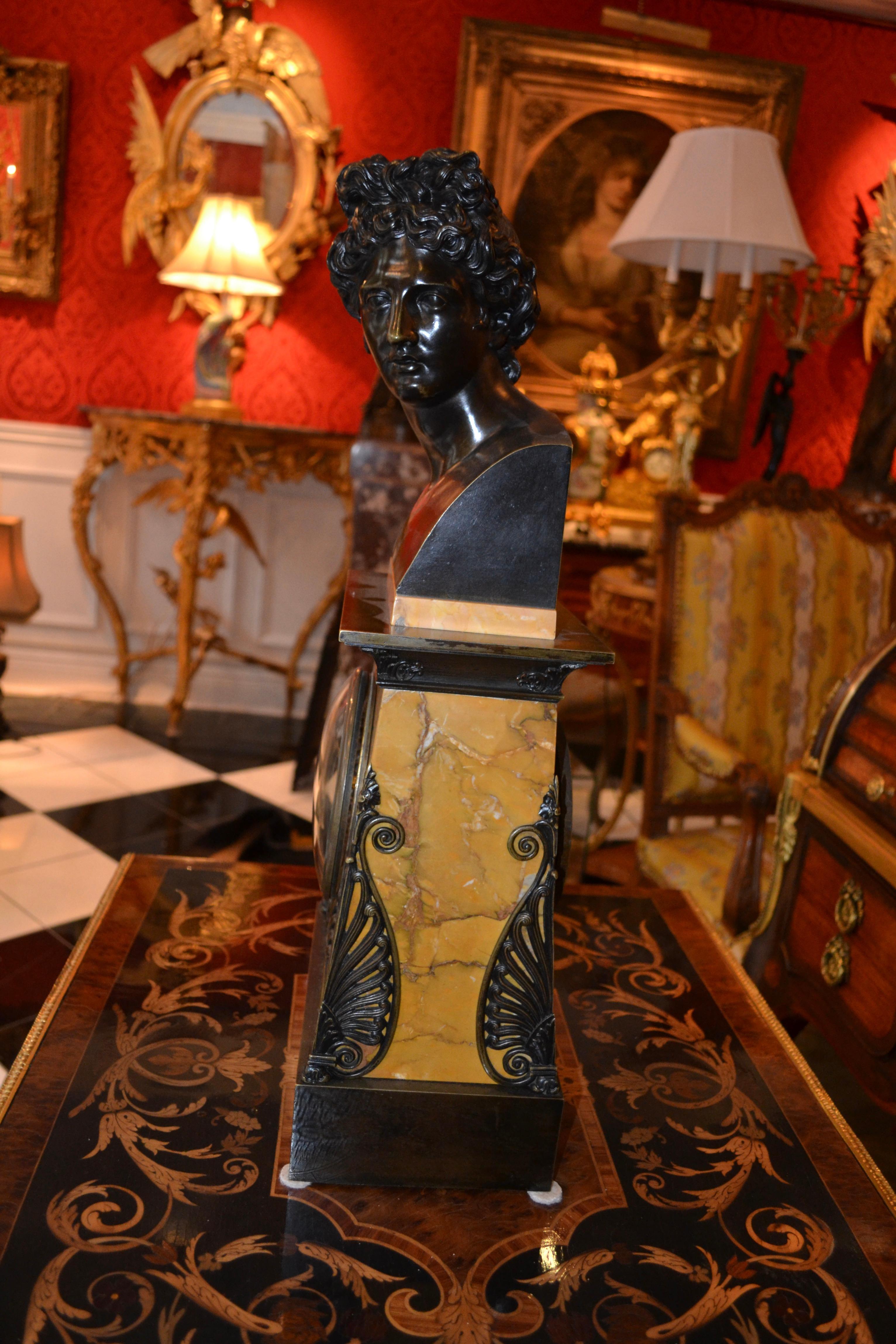 19th Century   Empire Bronze and Sienna Marble Clock with a bust of Apollo Belvedere For Sale
