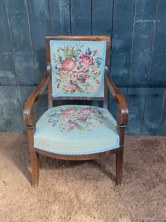 Empire period armchair in walnut, upholstery redone