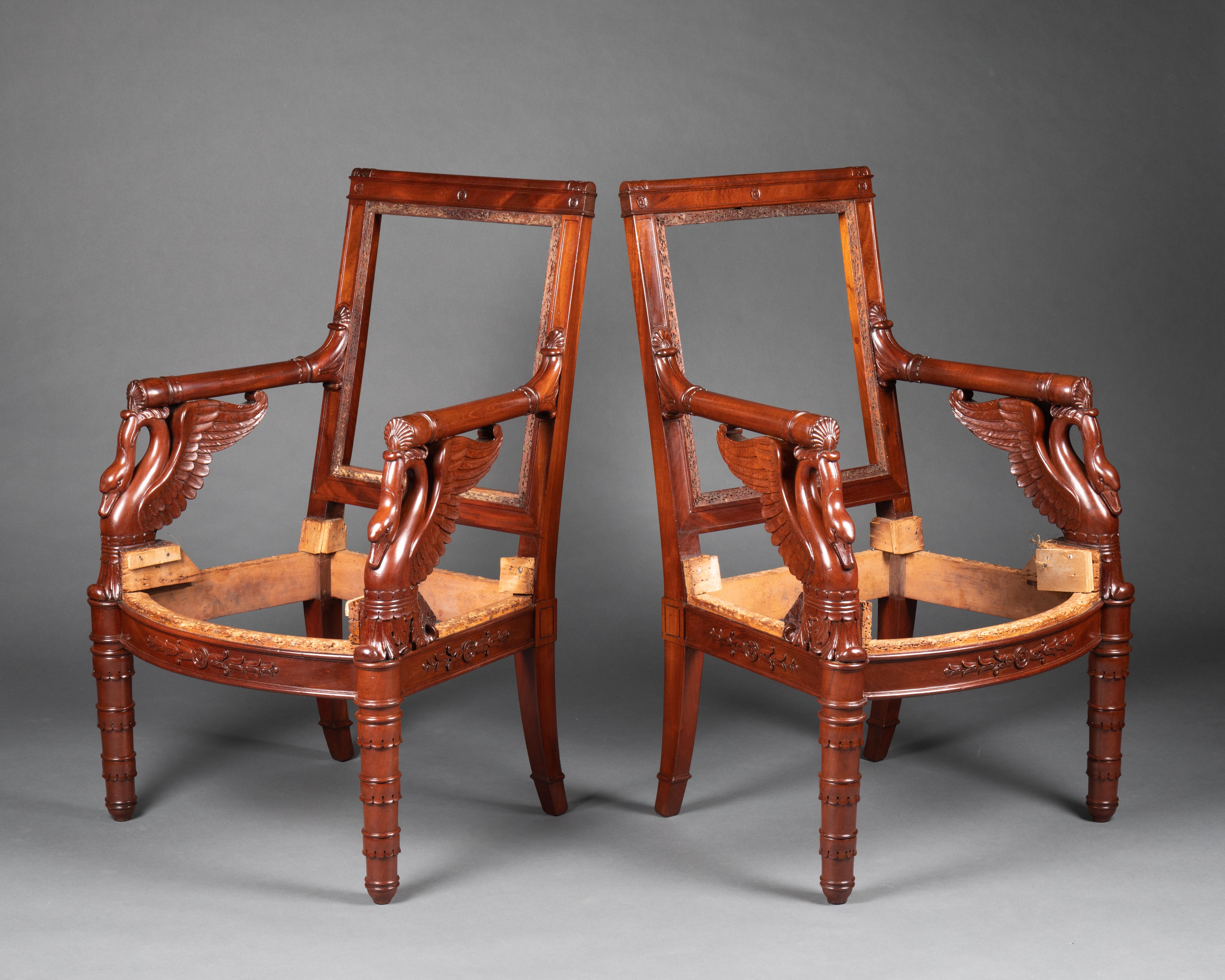 EXCEPTIONAL seats by Pierre Bellangé

PAIR OF ARMCHAIRS, circa 1805
Mahogany with mahogany veneer. Powerful tapered front legs with three scalloped rings, and sabre back legs.
Slightly arched front stretcher with sculpted decoration centered around