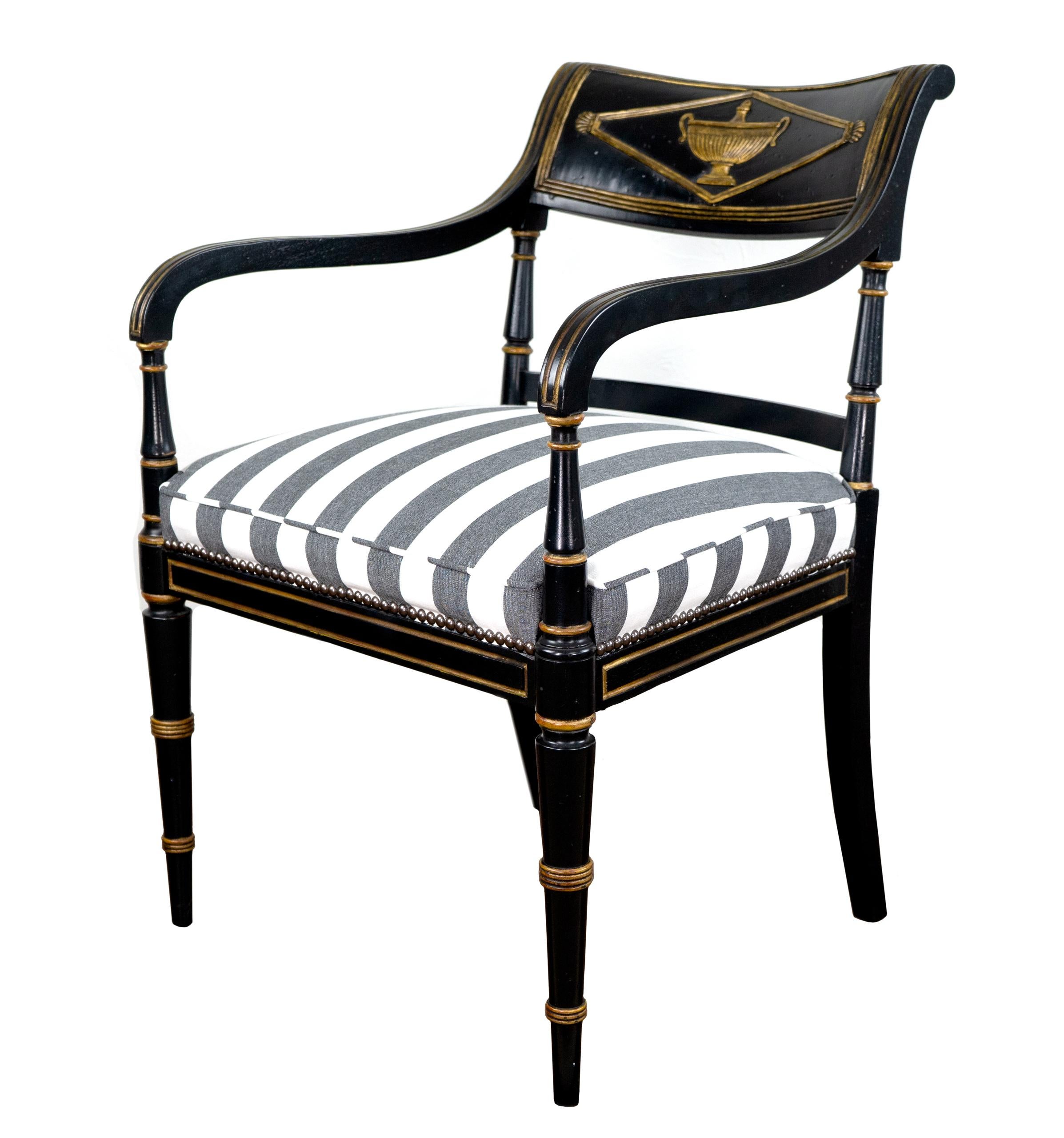 Beautiful set of 4 black painted chairs with gilding detail. 1930s empire style with new striped upholstery. The chairs are in great condition.