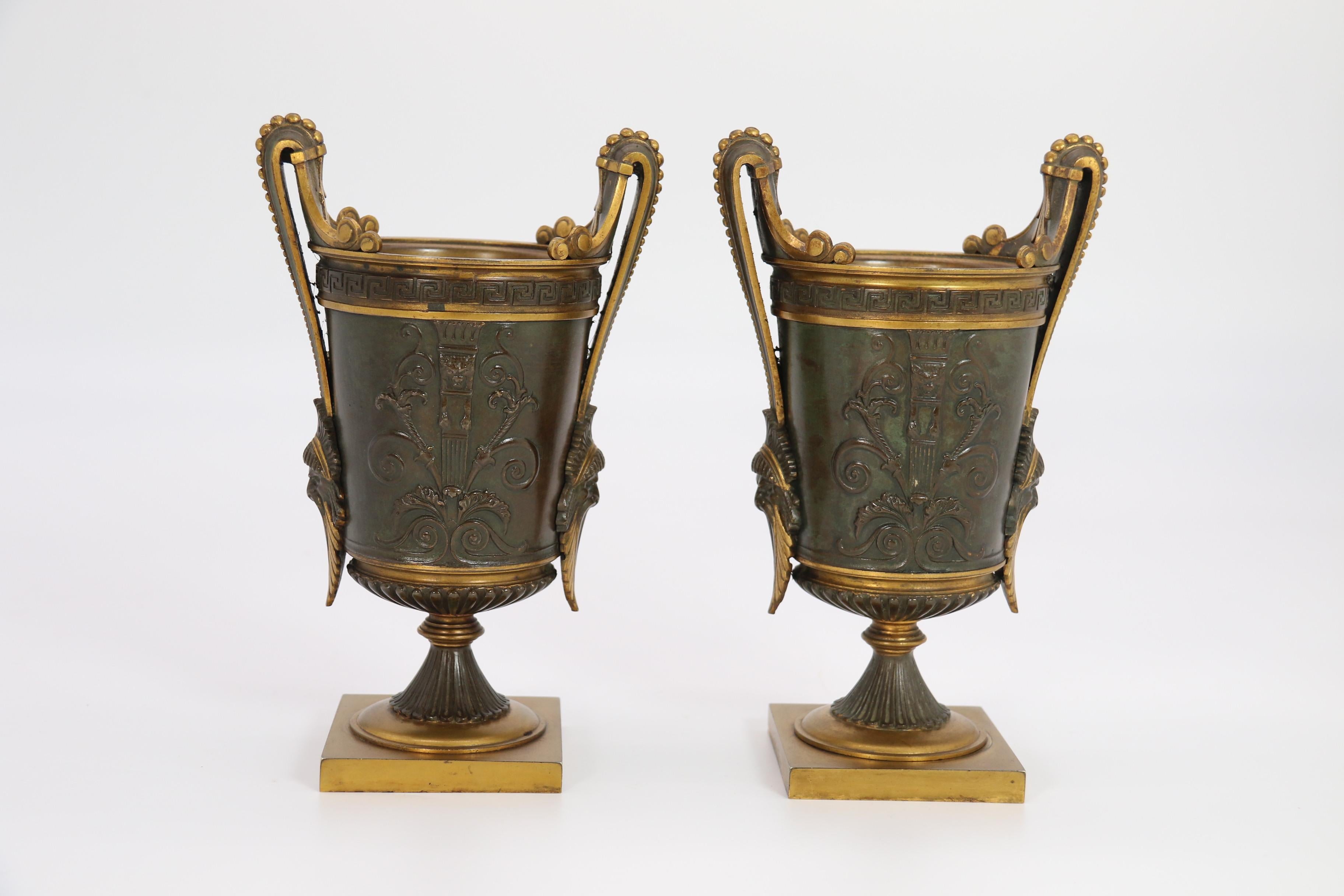French Empire period bronze and ormolu Grecian style pair of classical urns, circa 1830 For Sale