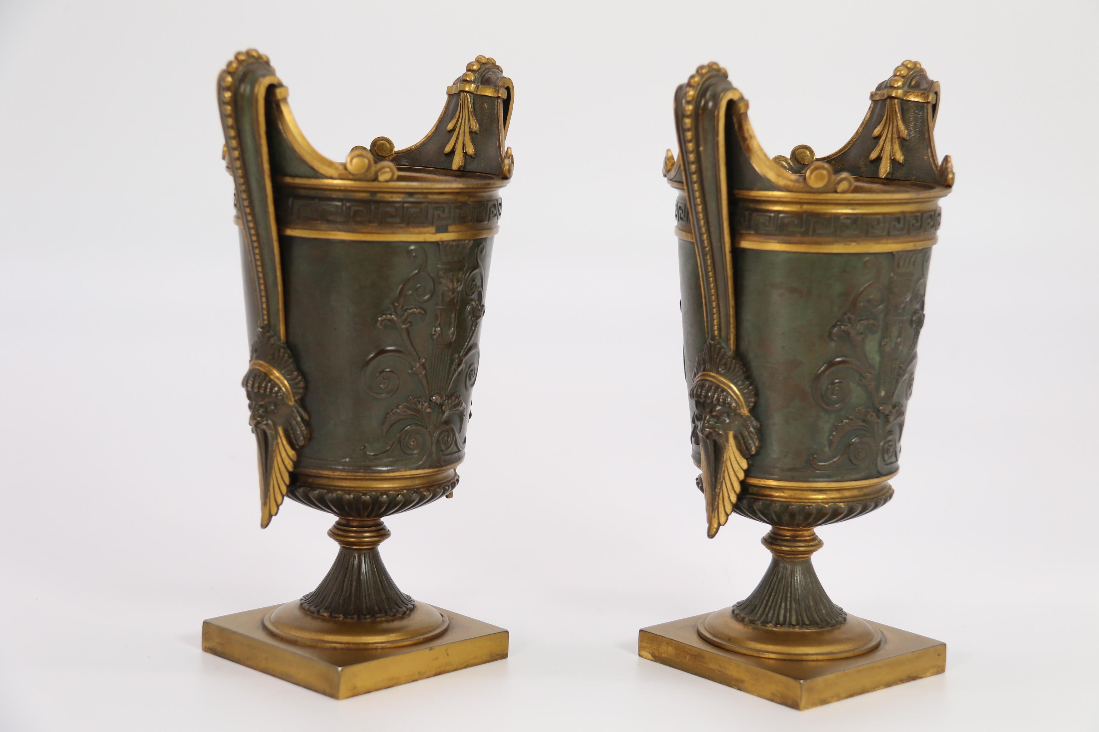 Cast Empire period bronze and ormolu Grecian style pair of classical urns, circa 1830 For Sale