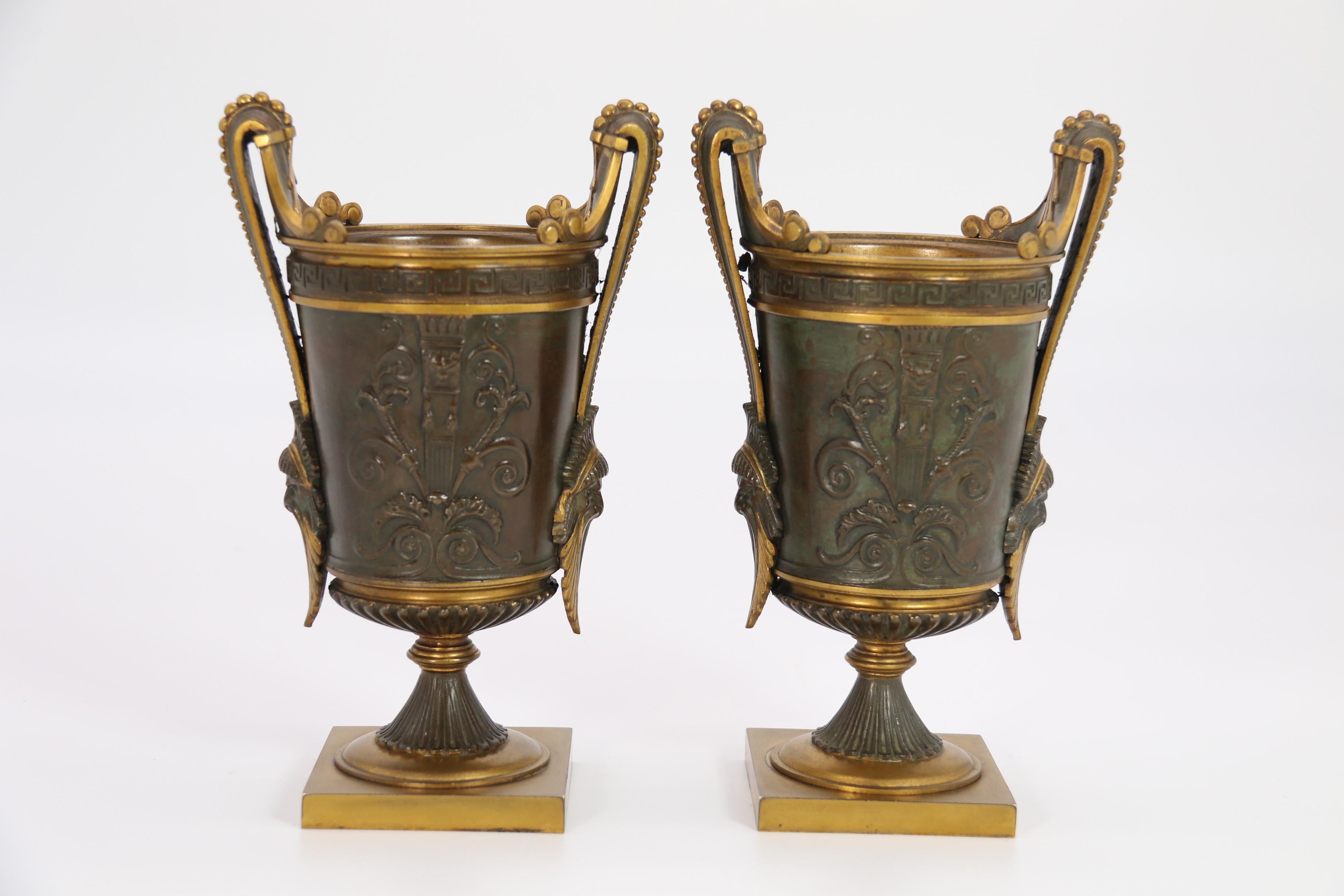 Bronze Empire period bronze and ormolu Grecian style pair of classical urns, circa 1830 For Sale
