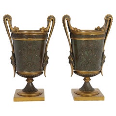 Vintage Empire period bronze and ormolu Grecian style pair of classical urns, circa 1830