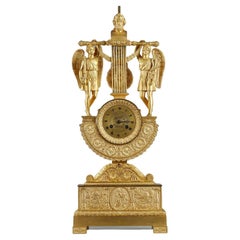 Horloge en forme de lyre en bronze doré d'époque Empire avec un buste de propriétaire