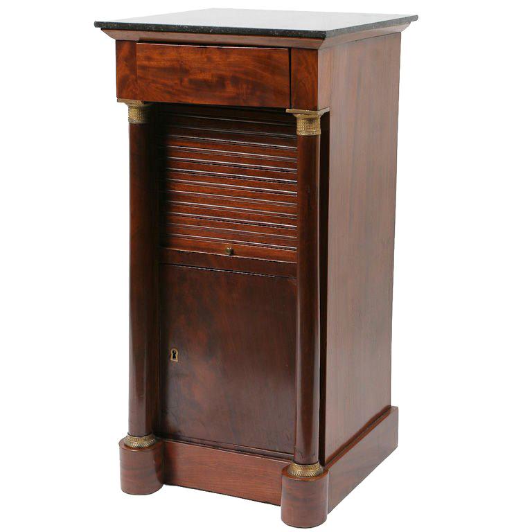Empire period mahogany night stand / pedestal decorated with gilt bronze mounts and black fossilized marble top.