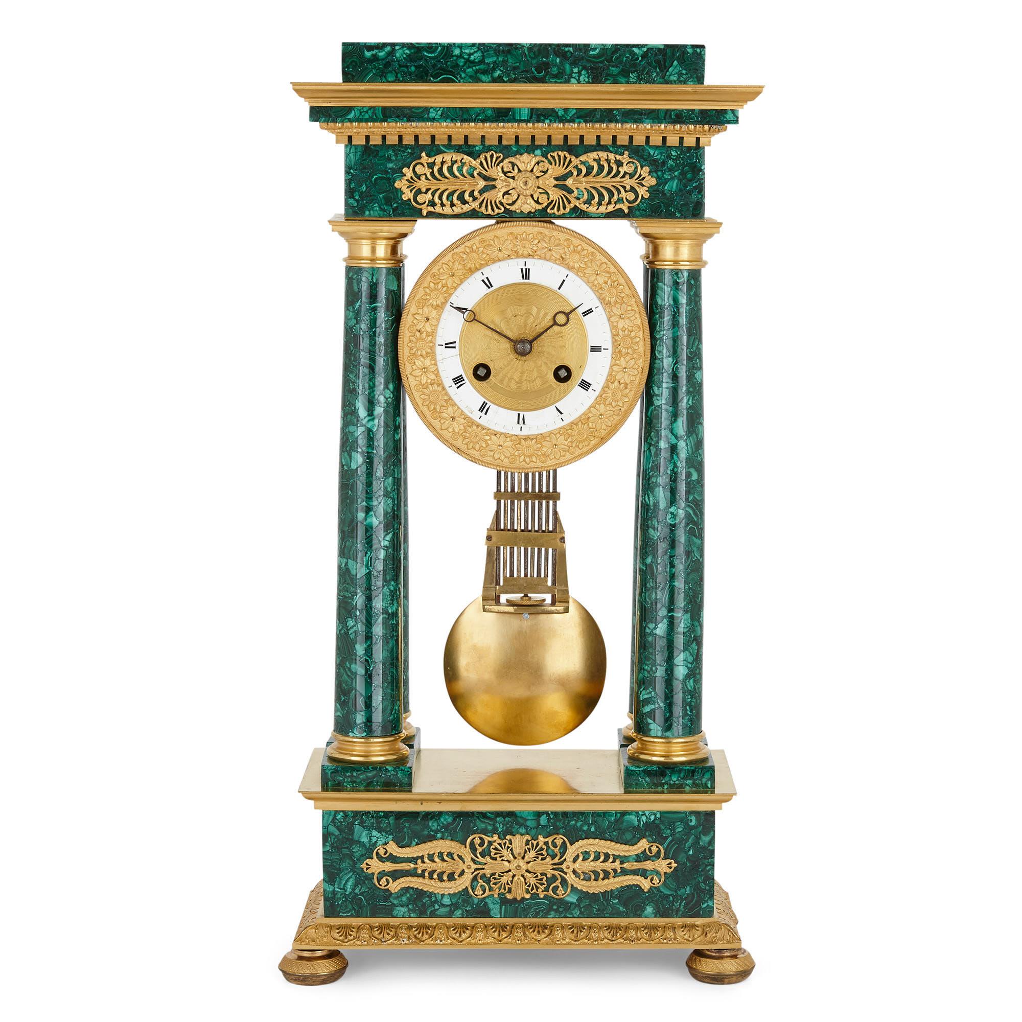 Empire period neoclassical malachite and gilt bronze mantel clock
French, early 19th century
Dimensions: Height 48cm, width 23.5cm, depth 11cm

This mantel clock was finely crafted in the Empire period, wrought from ormolu and a later malachite