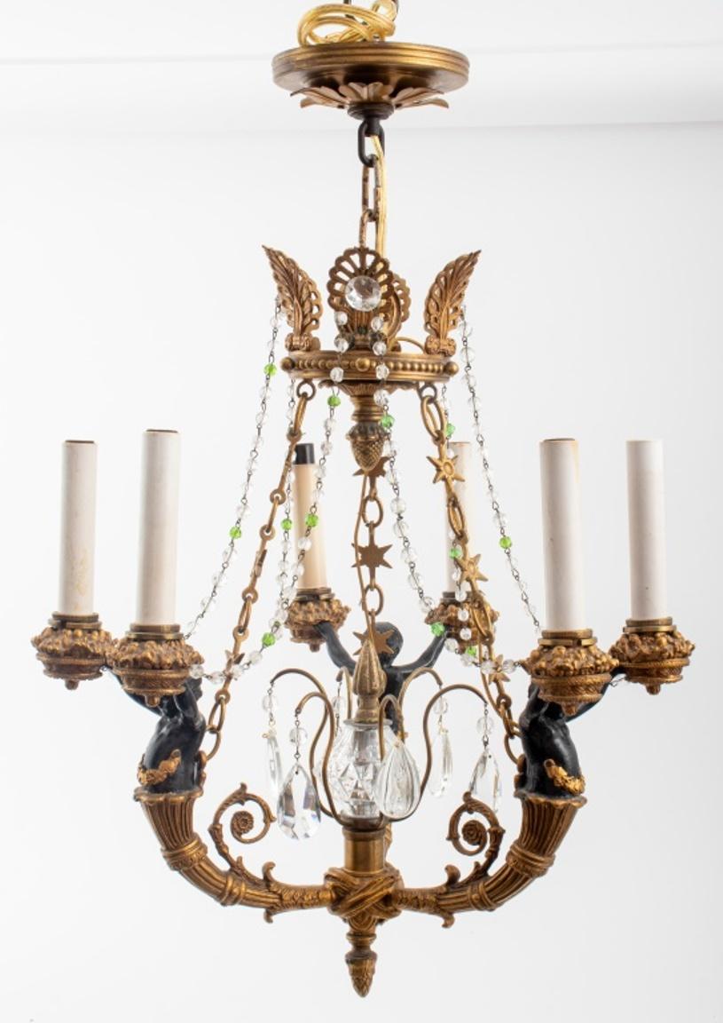 French Empire revival chandelier in gilt bronze with crystal droplets, the six lights held up by blackened bronze putti. Measures: 23