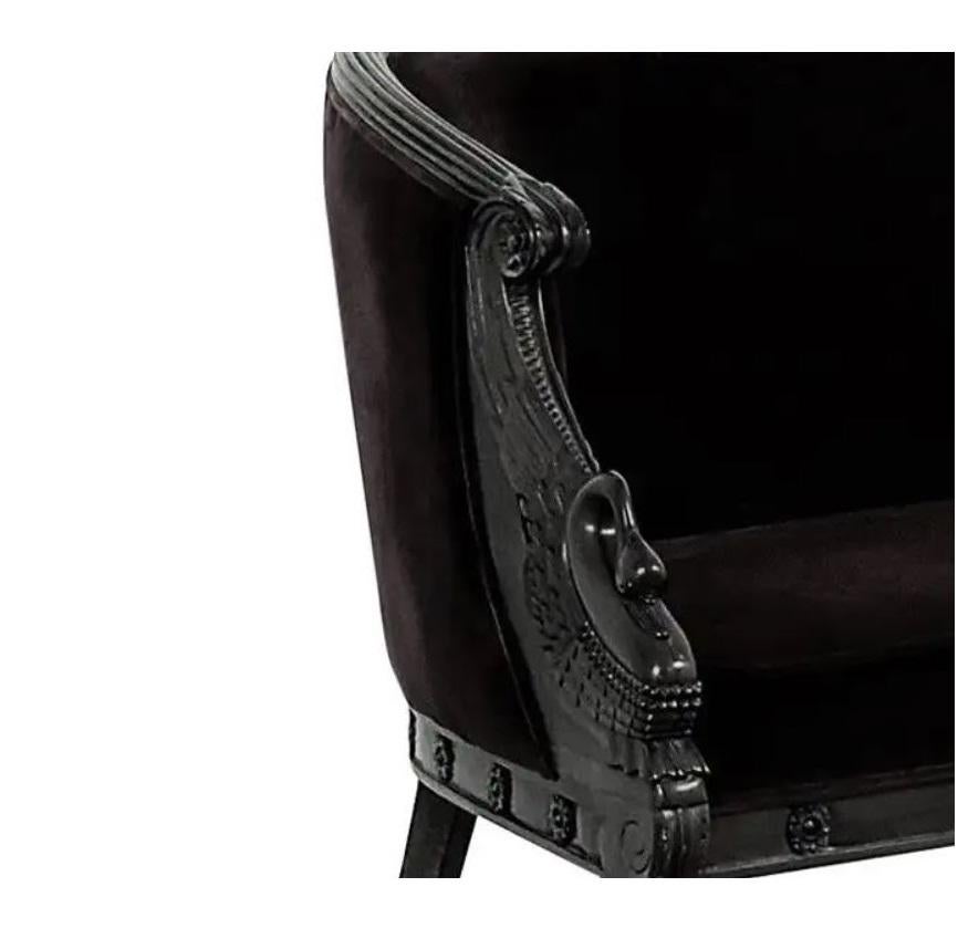 Elegant French Empire style settee offers a truly spectacular silhouette that is sure to impress. Wonderfully detailed featuring a reeded top rail, down swept arms are intricately hand-carved into intricate winged swans ending in scrolls giving it a