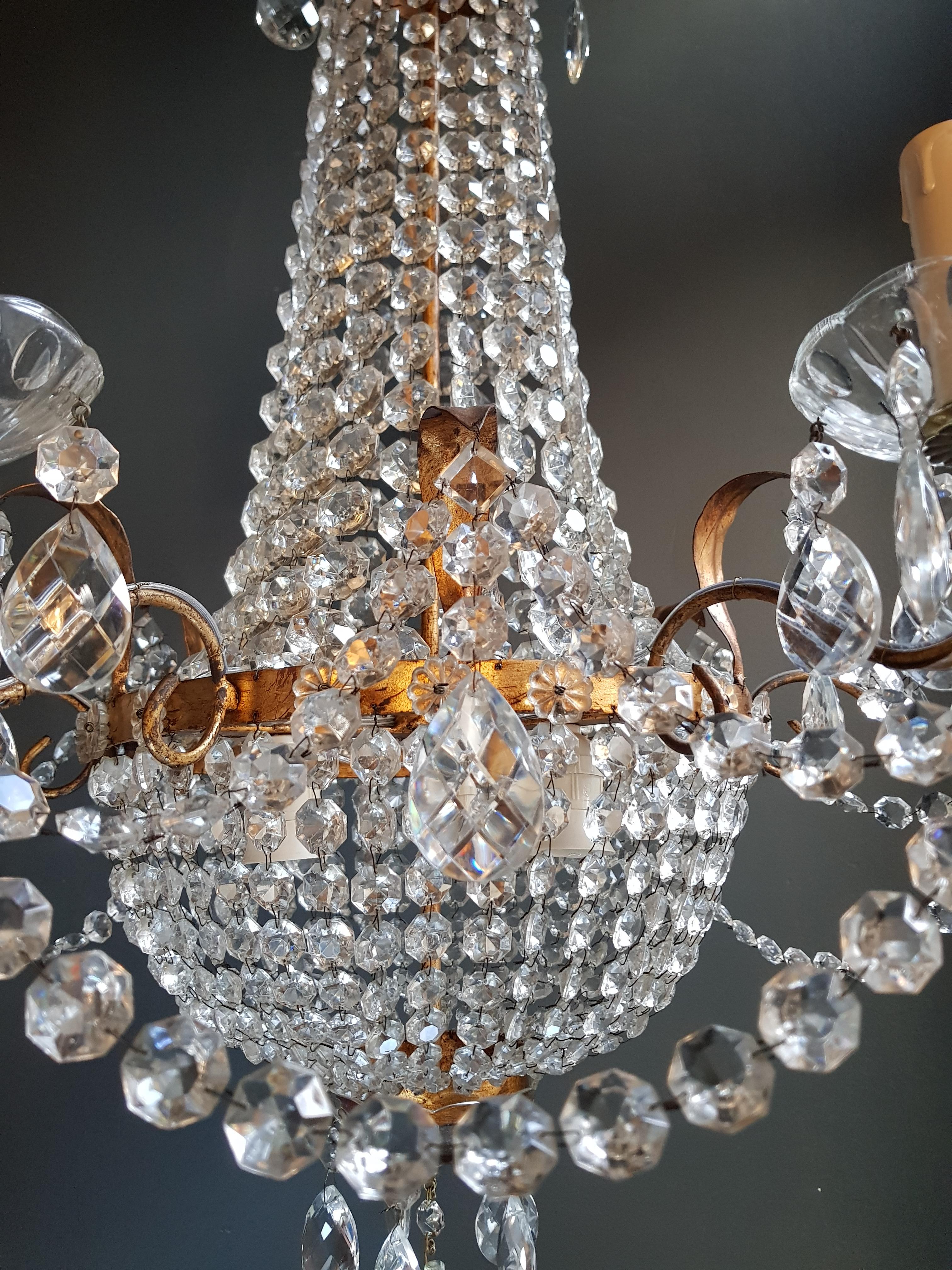 Empire Sac a pearl iron chandelier crystal lustre ceiling lamp basket antique, 1940

Measures: Total height 130 cm, height without chain 75 cm, diameter 70 cm. Weight (approximately): 13kg.

Number of lights: 9-light bulb sockets: 6x E14 and 3 x